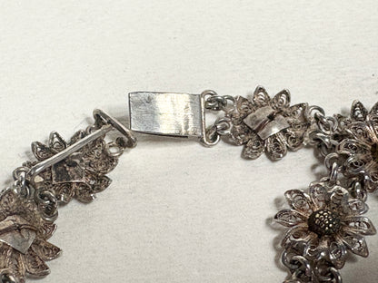 Vintage two-toned 800 silver floral daisy bracelet with gold-plated centers.