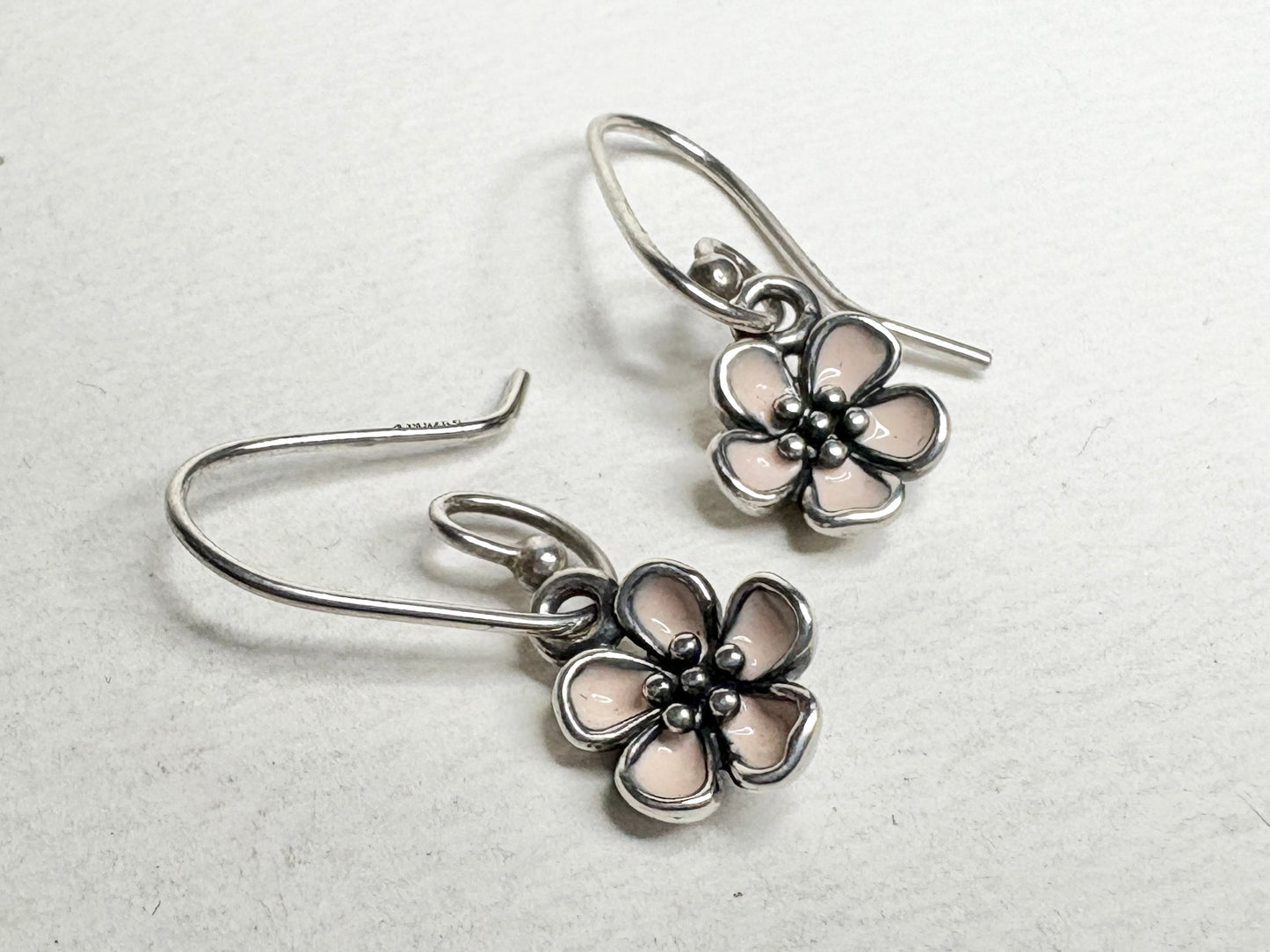Pandora sterling silver dangle earrings with pink enamel cherry blossom charms.