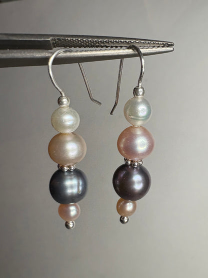 Sterling silver dangle earrings with four colorful freshwater pearls.