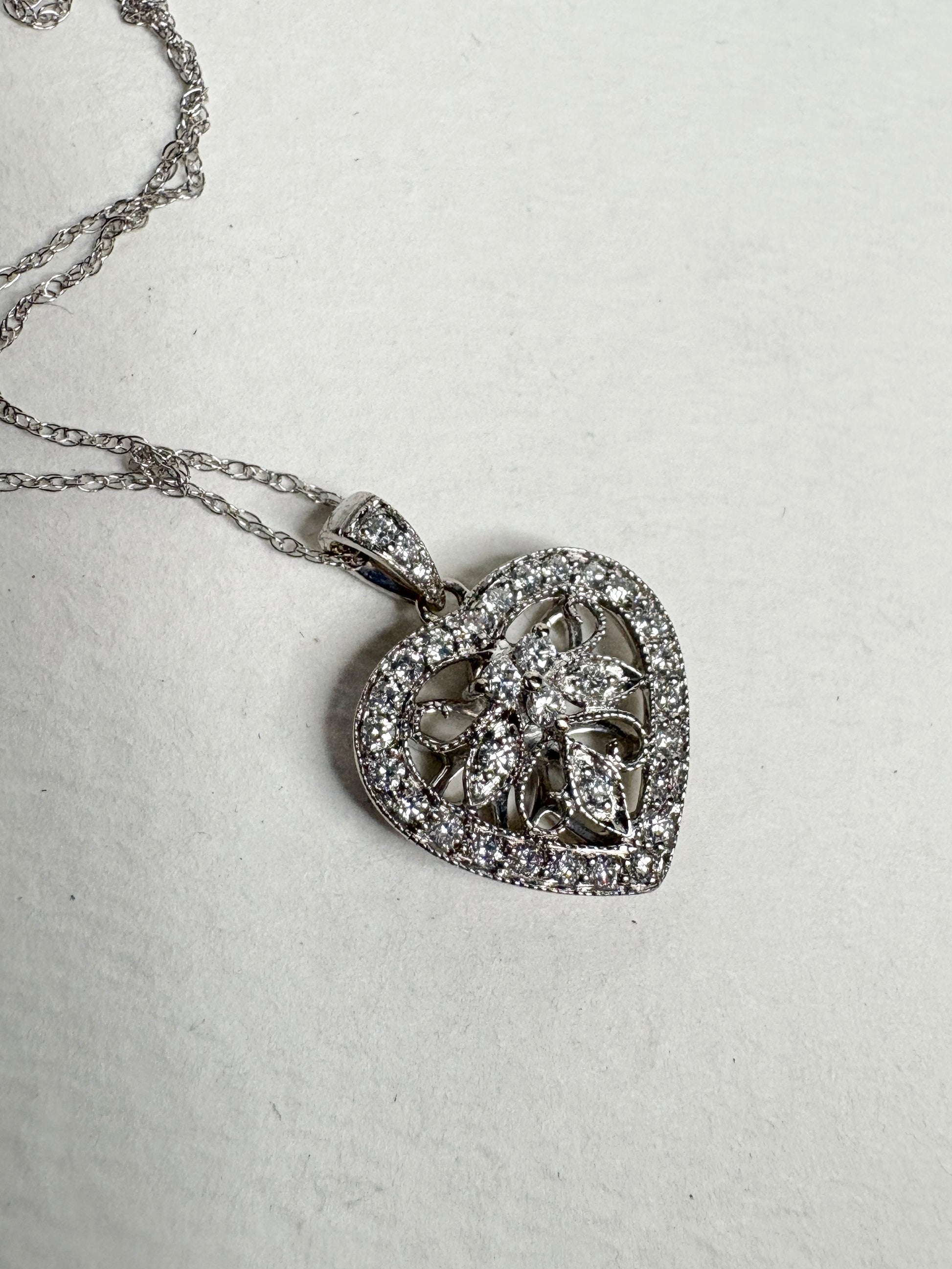 14k white gold heart pendant necklace with natural diamonds.