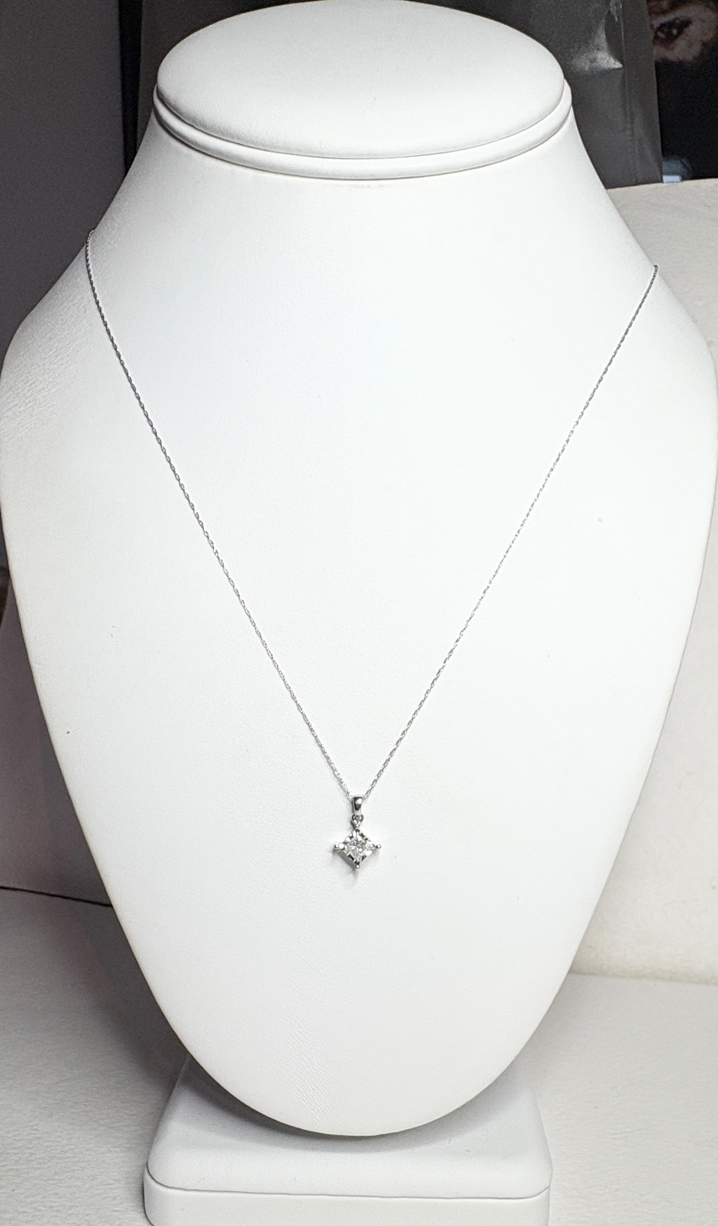 Princess cut diamond pendant necklace in 10k white gold on a 21" chain.