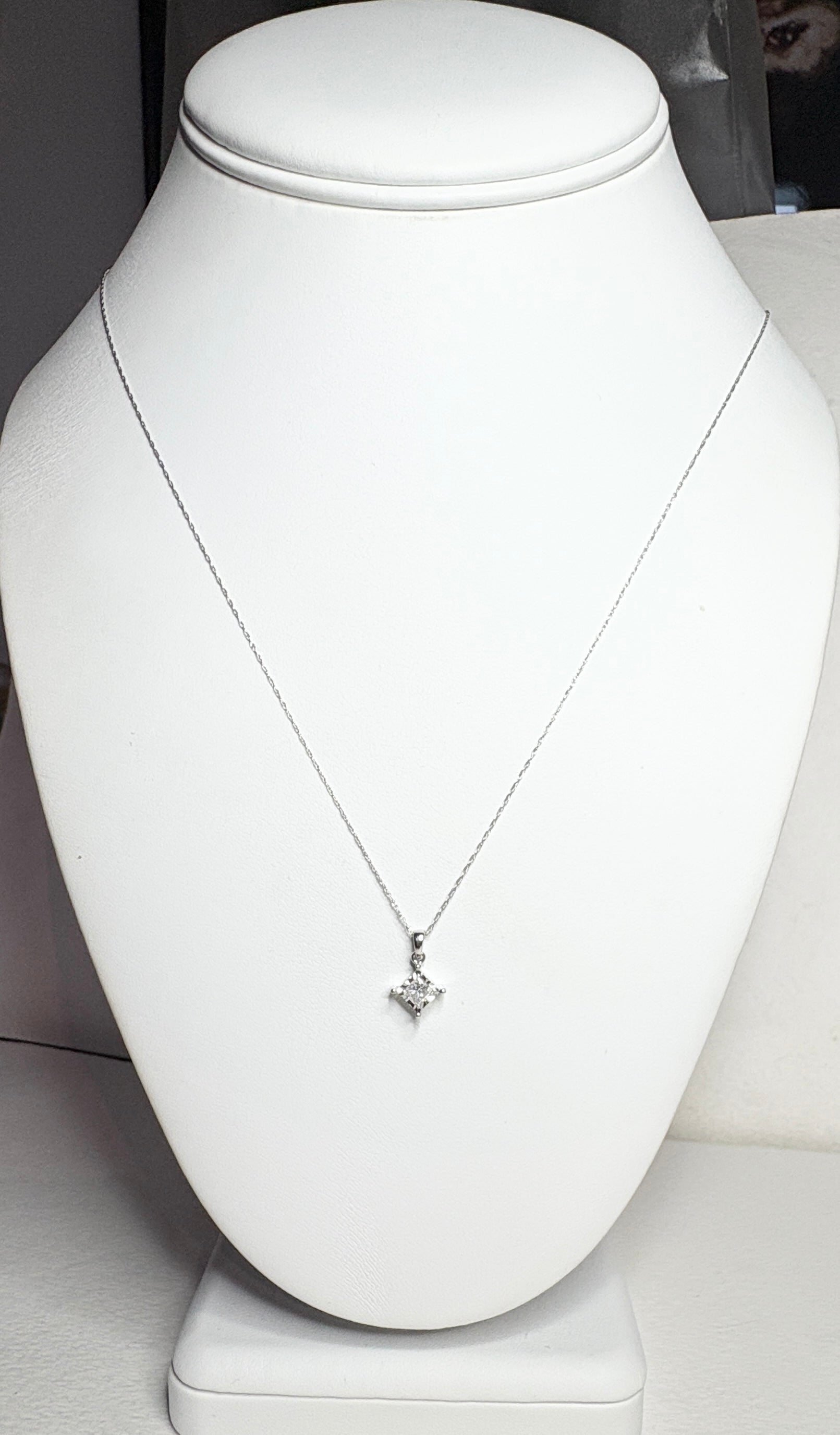 Princess cut diamond pendant necklace in 10k white gold on a 21" chain.