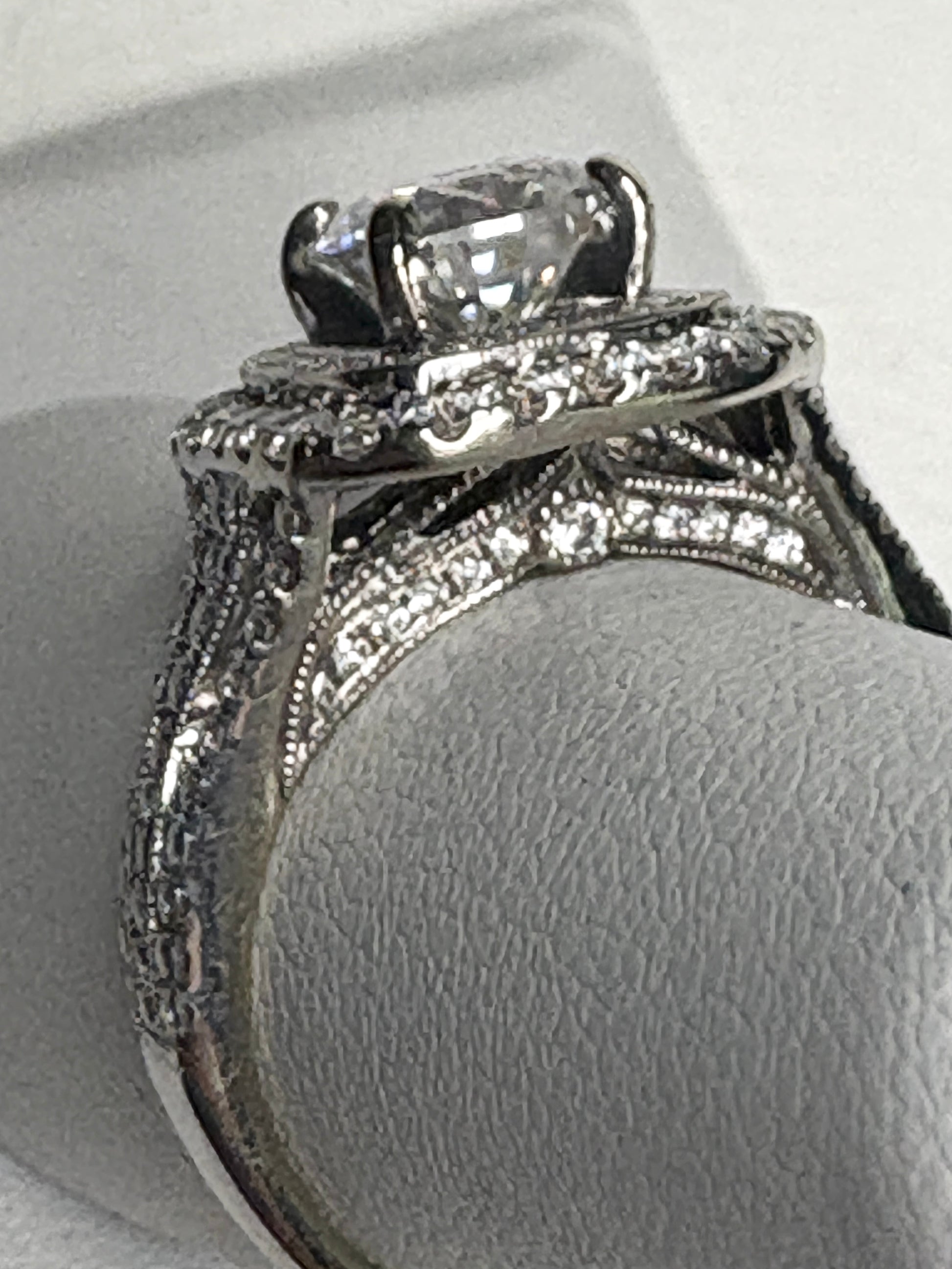 A 14k white gold ring setting with natural diamonds and a moissanite center stone.