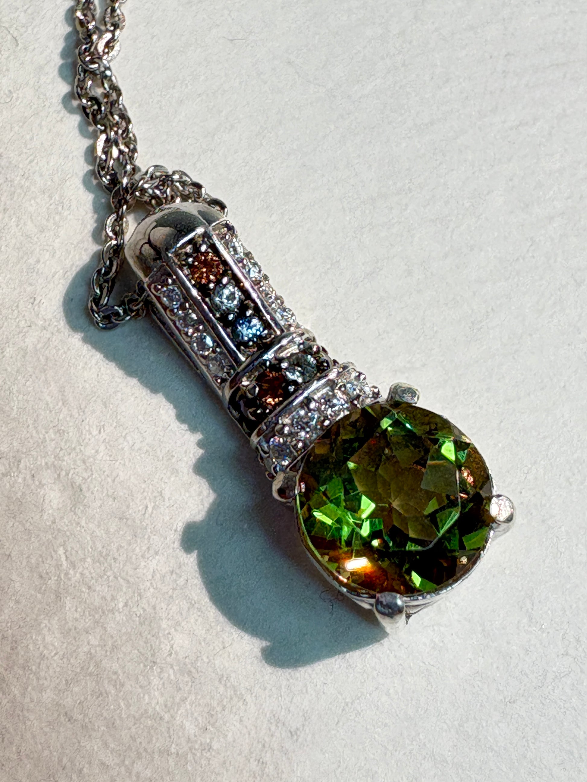 Sterling silver pendant necklace with color-change glass, moissanite, and multi-color sapphires.