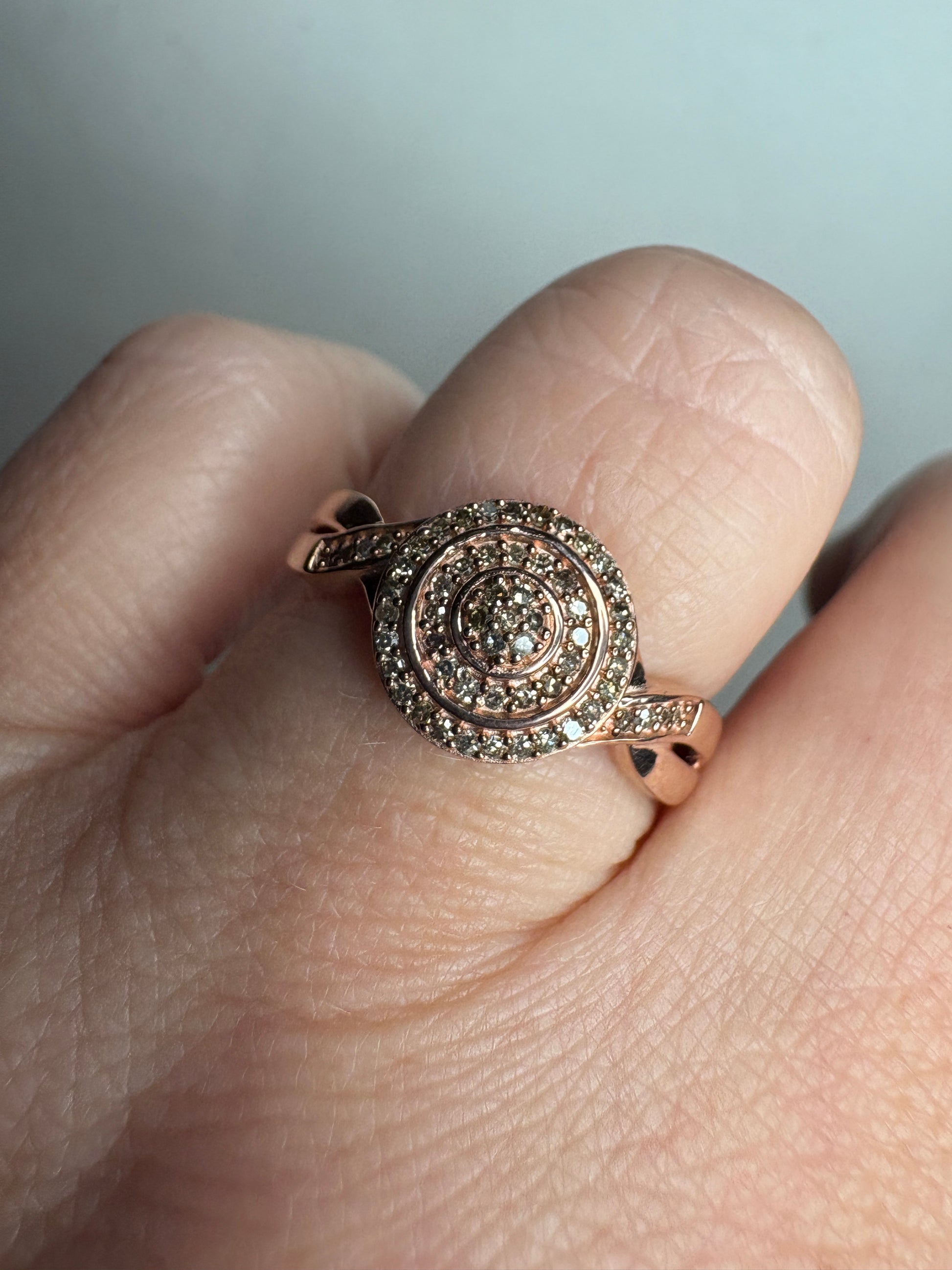 Rose gold ring with pave set champagne and brown diamonds.