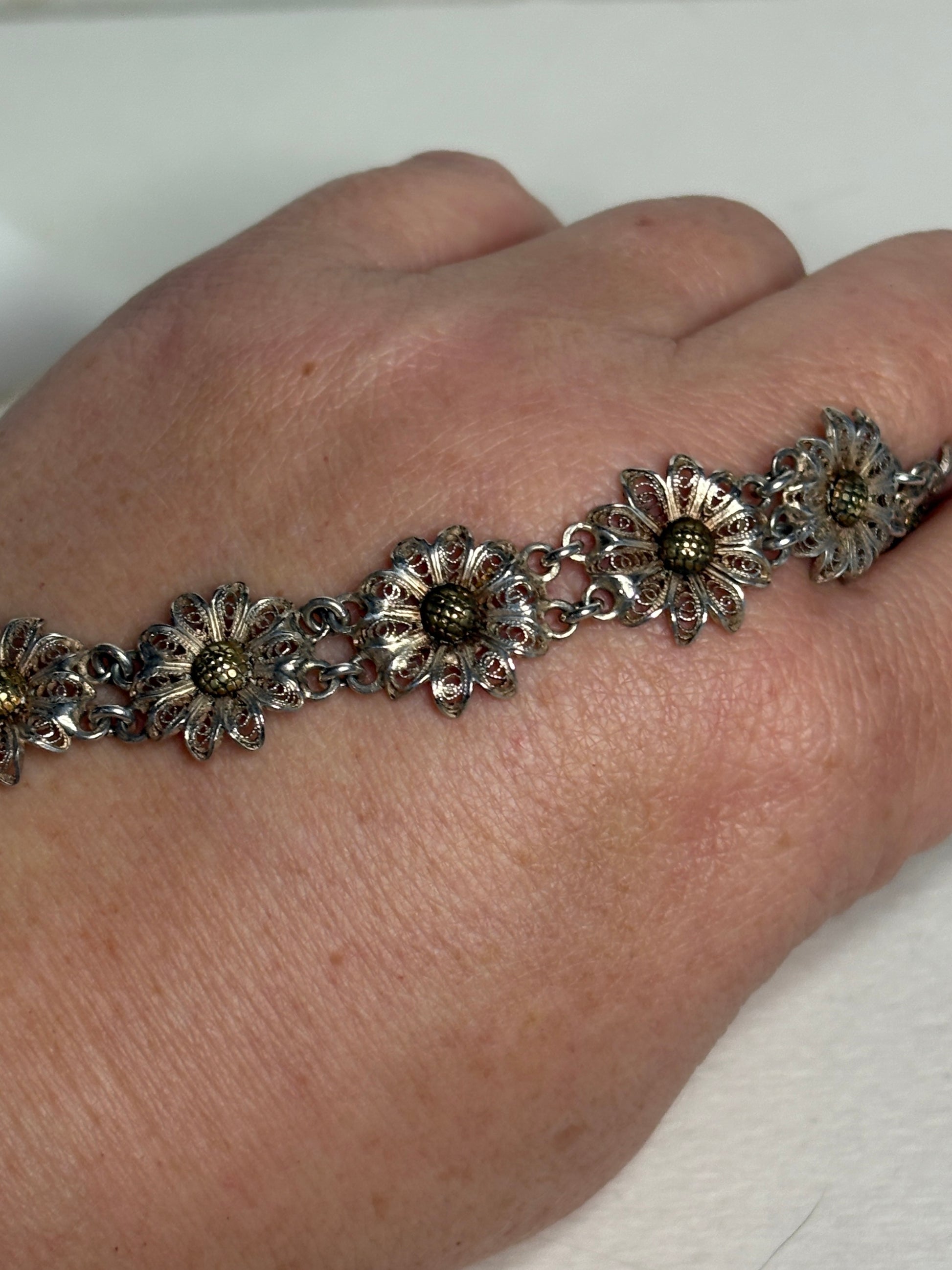 Vintage two-toned 800 silver filigree floral daisy bracelet with gold-plated centers.