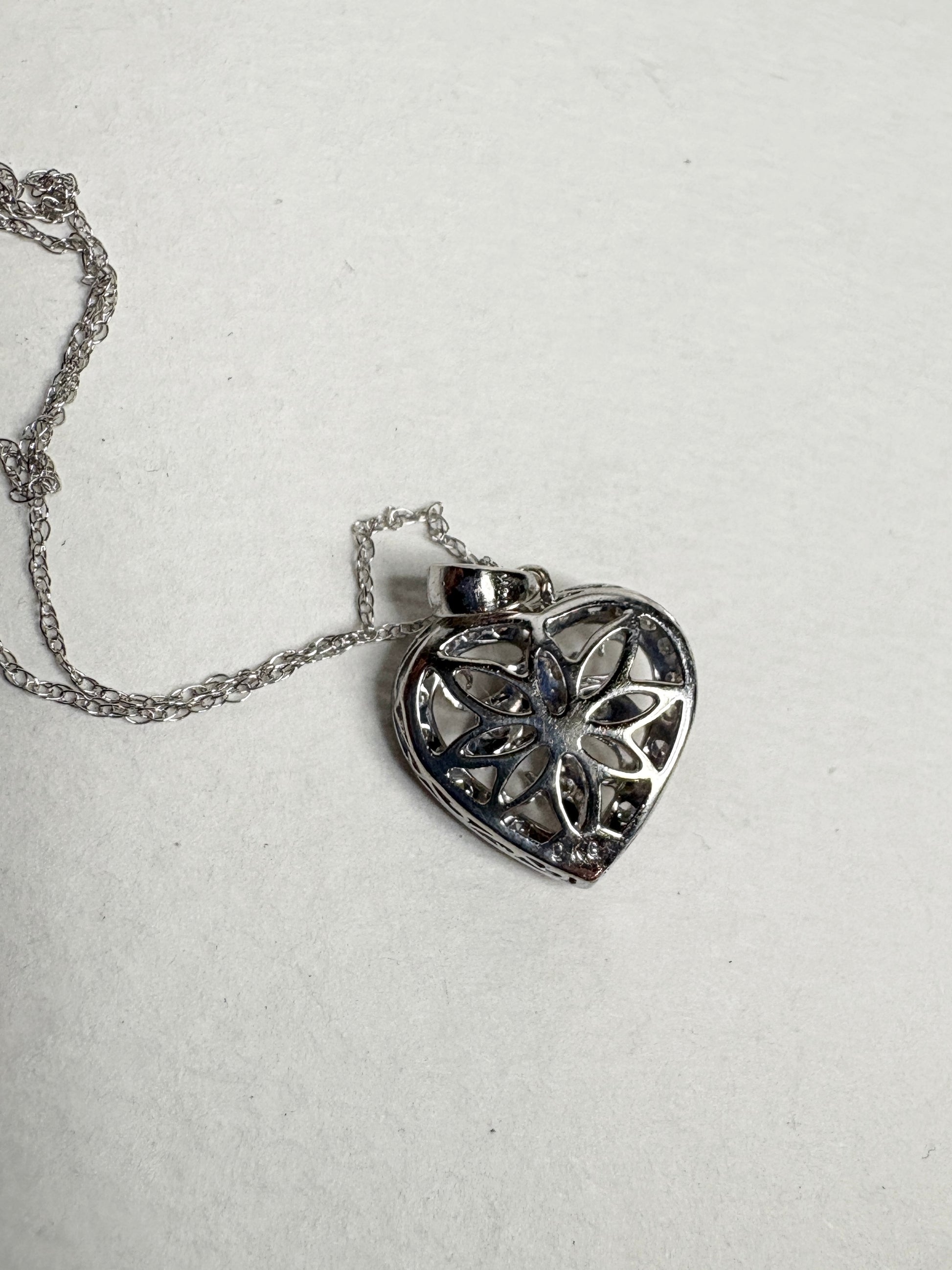 14k white gold heart pendant necklace with diamonds.