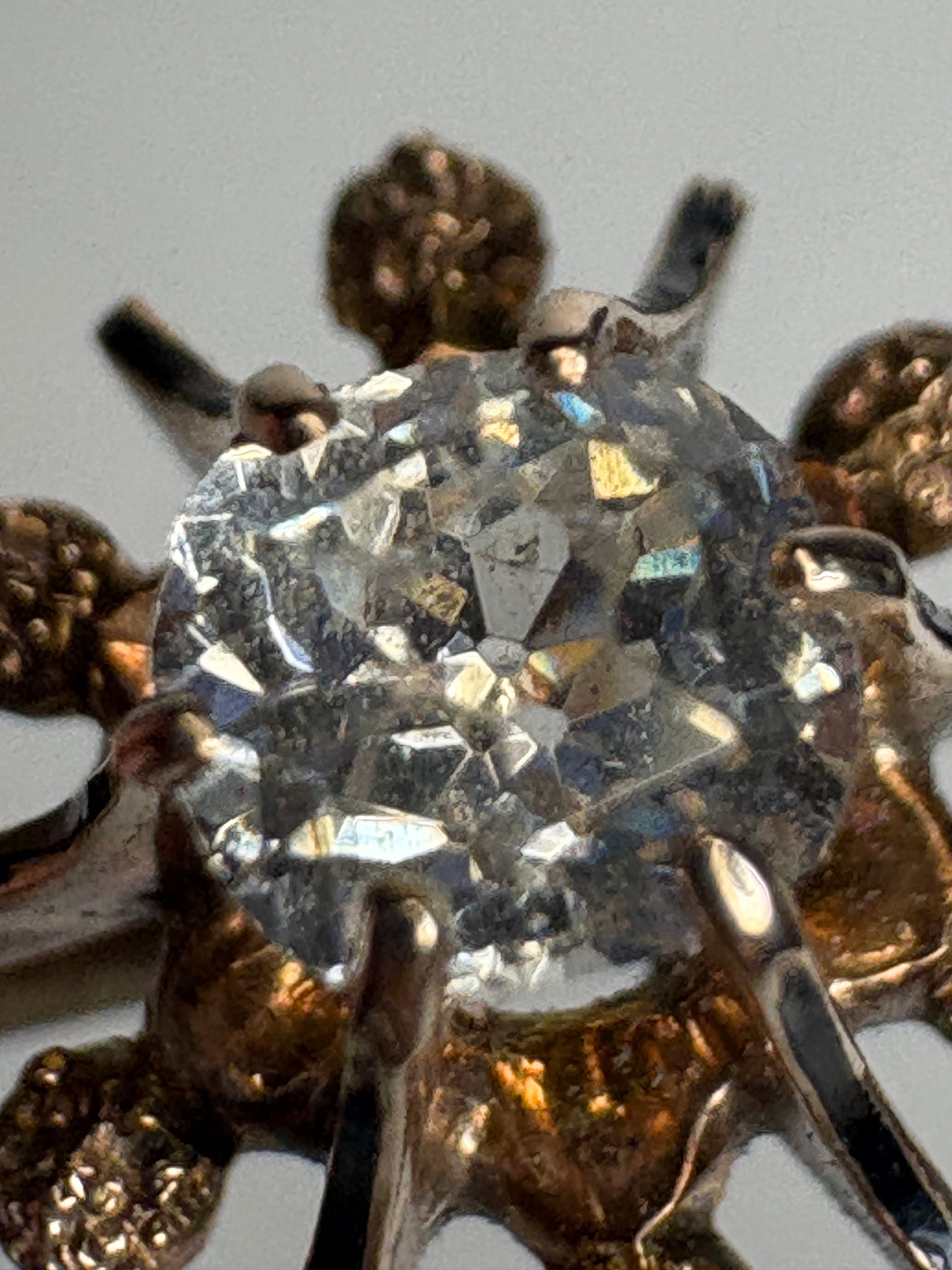 Antique Georgian era brooch with a hand-cut paste gem and enamel inlay.