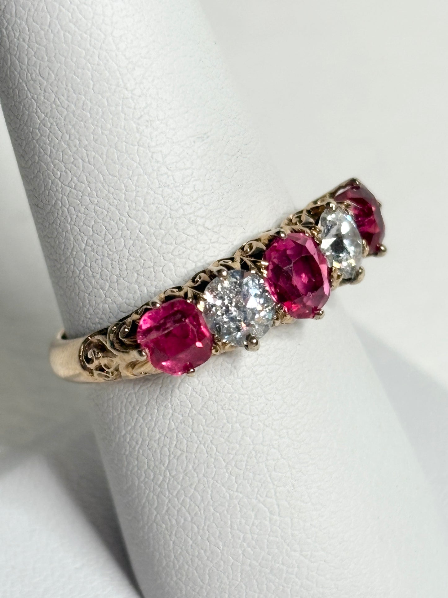 Antique 14k gold ring with red spinels and old mine cut diamonds.