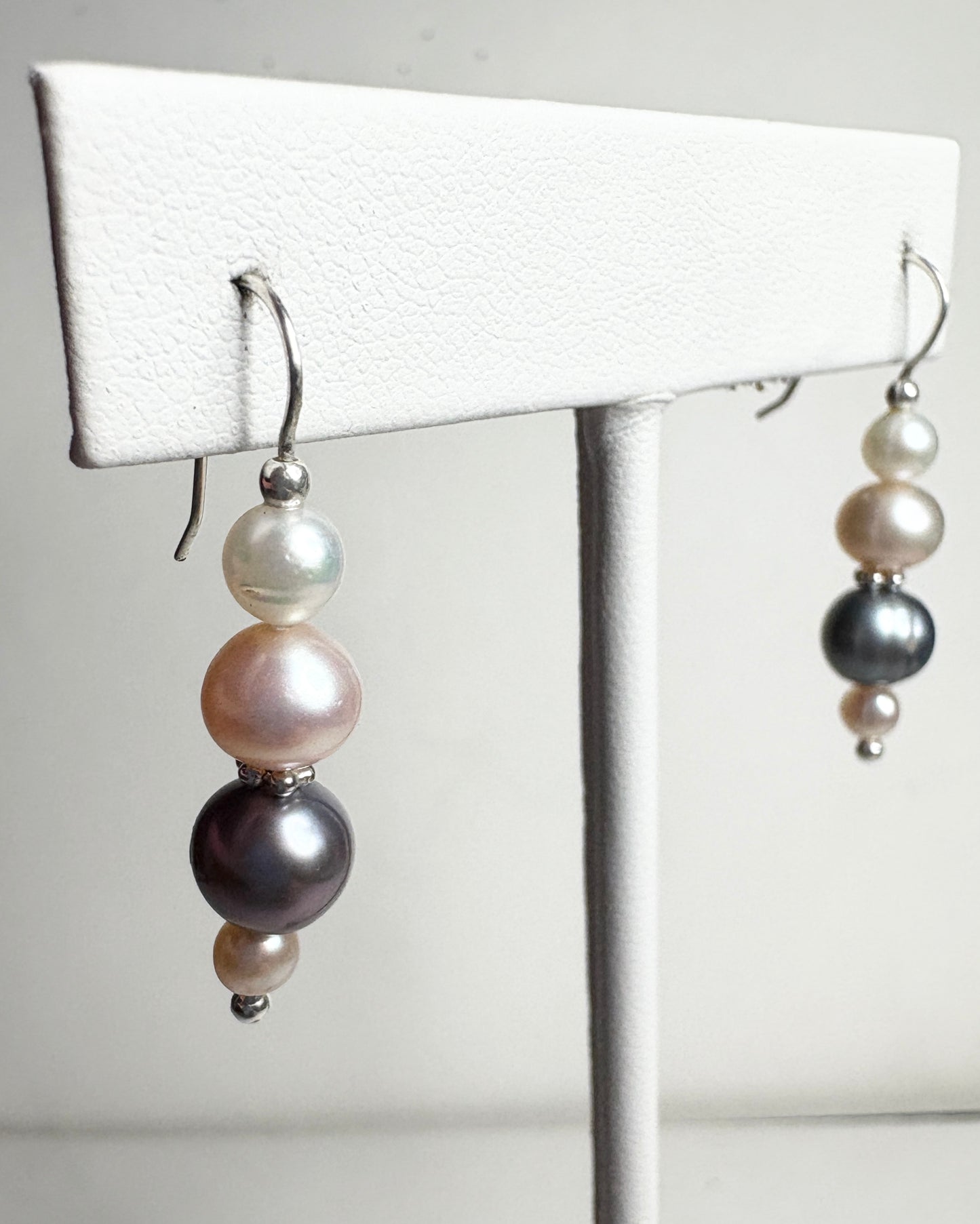 Sterling silver dangle earrings with colorful cultured freshwater pearls.