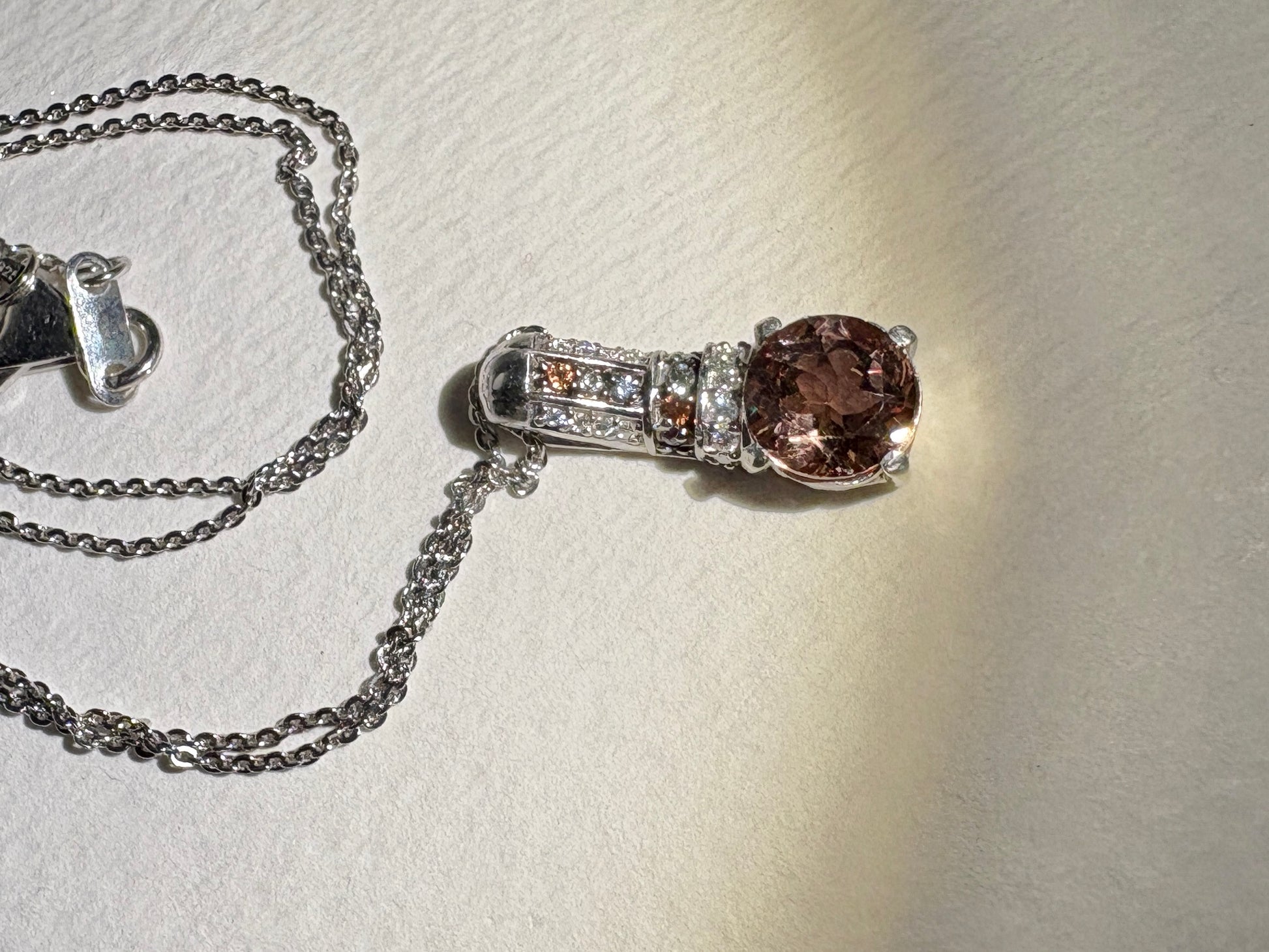 Sterling silver pendant necklace with color-change glass, moissanite, and multi-color sapphires.