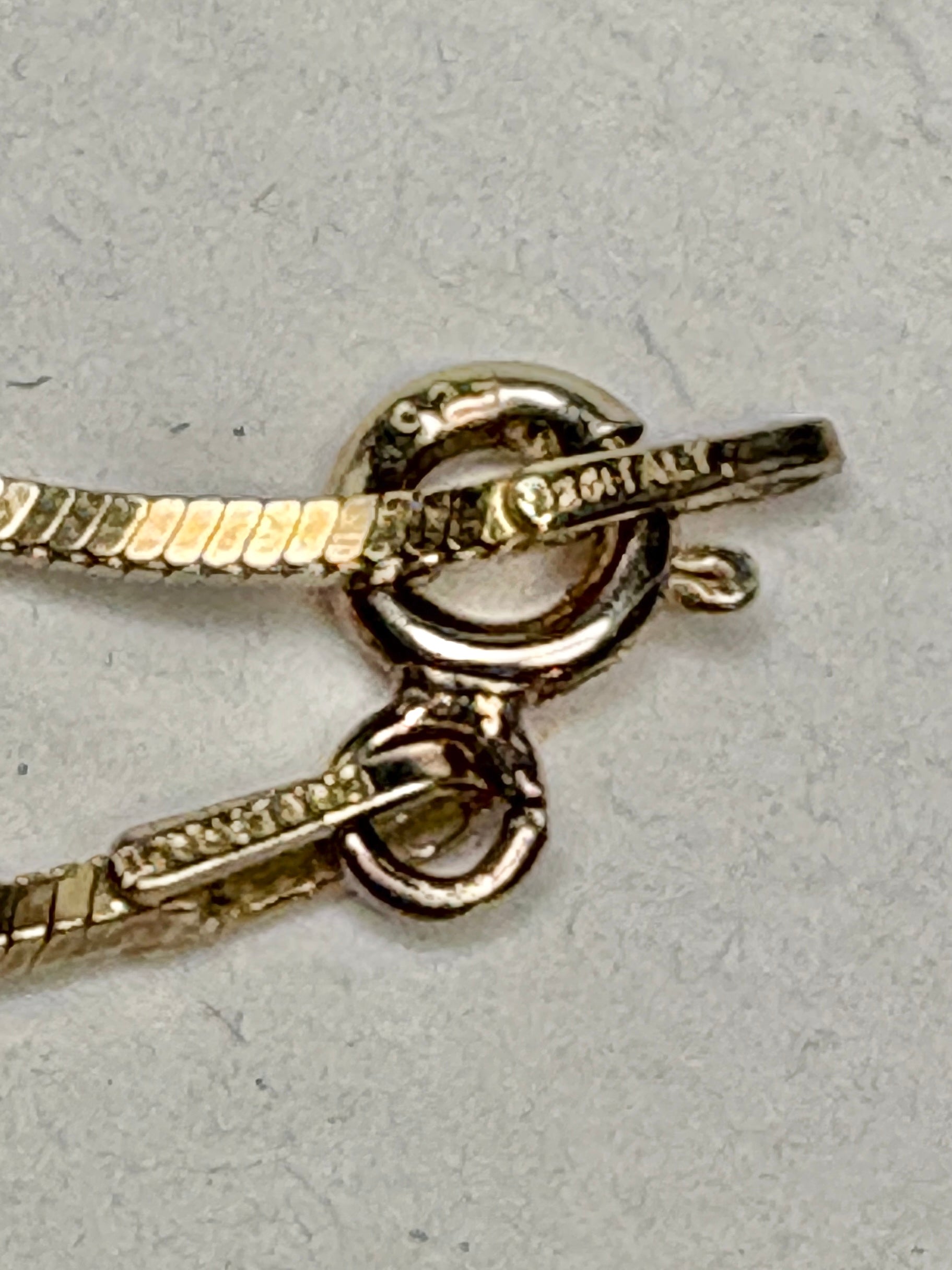 Gold over sterling silver necklace with a toggle clasp and a moissanite pendant.