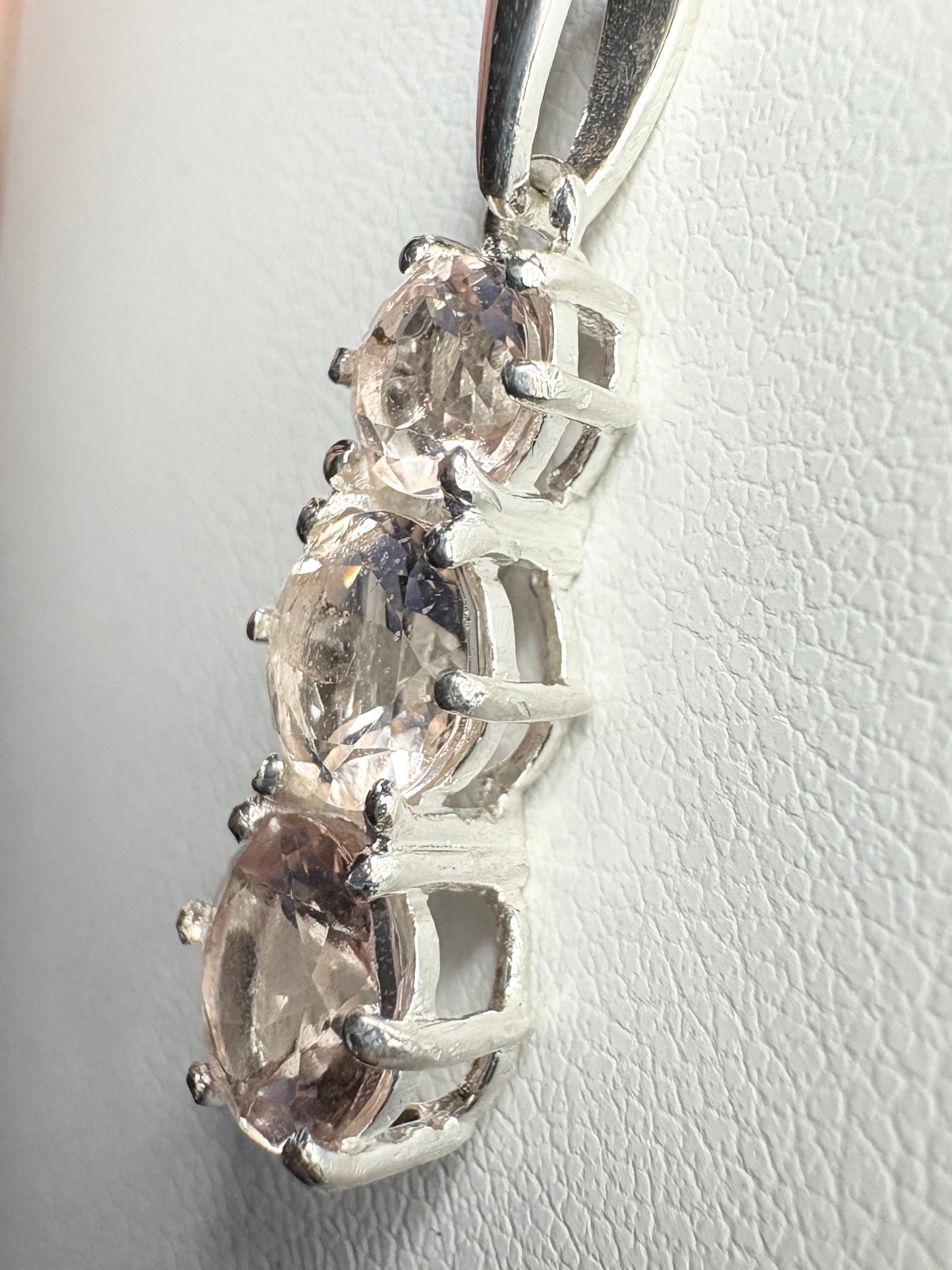 Sterling silver pendant necklace with three natural morganite stones.