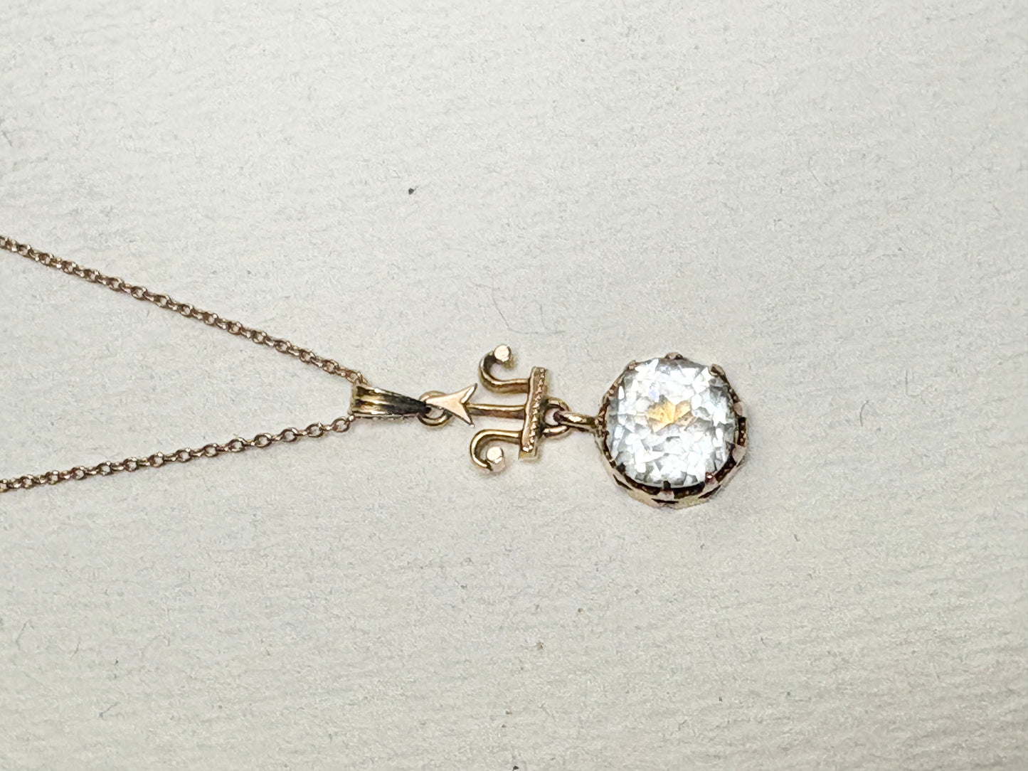Antique Victorian Etruscan Revival rock crystal quartz pendant necklace on a 10k chain.