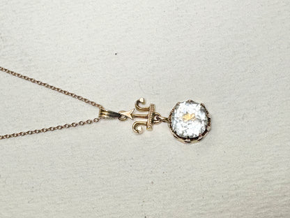Antique Victorian Etruscan Revival rock crystal quartz pendant necklace on a 10k chain.