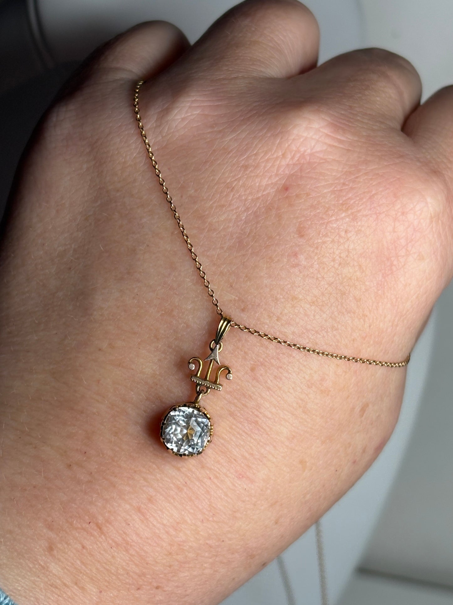 Antique Victorian Etruscan Revival rock crystal quartz pendant necklace on a 14k gold chain.