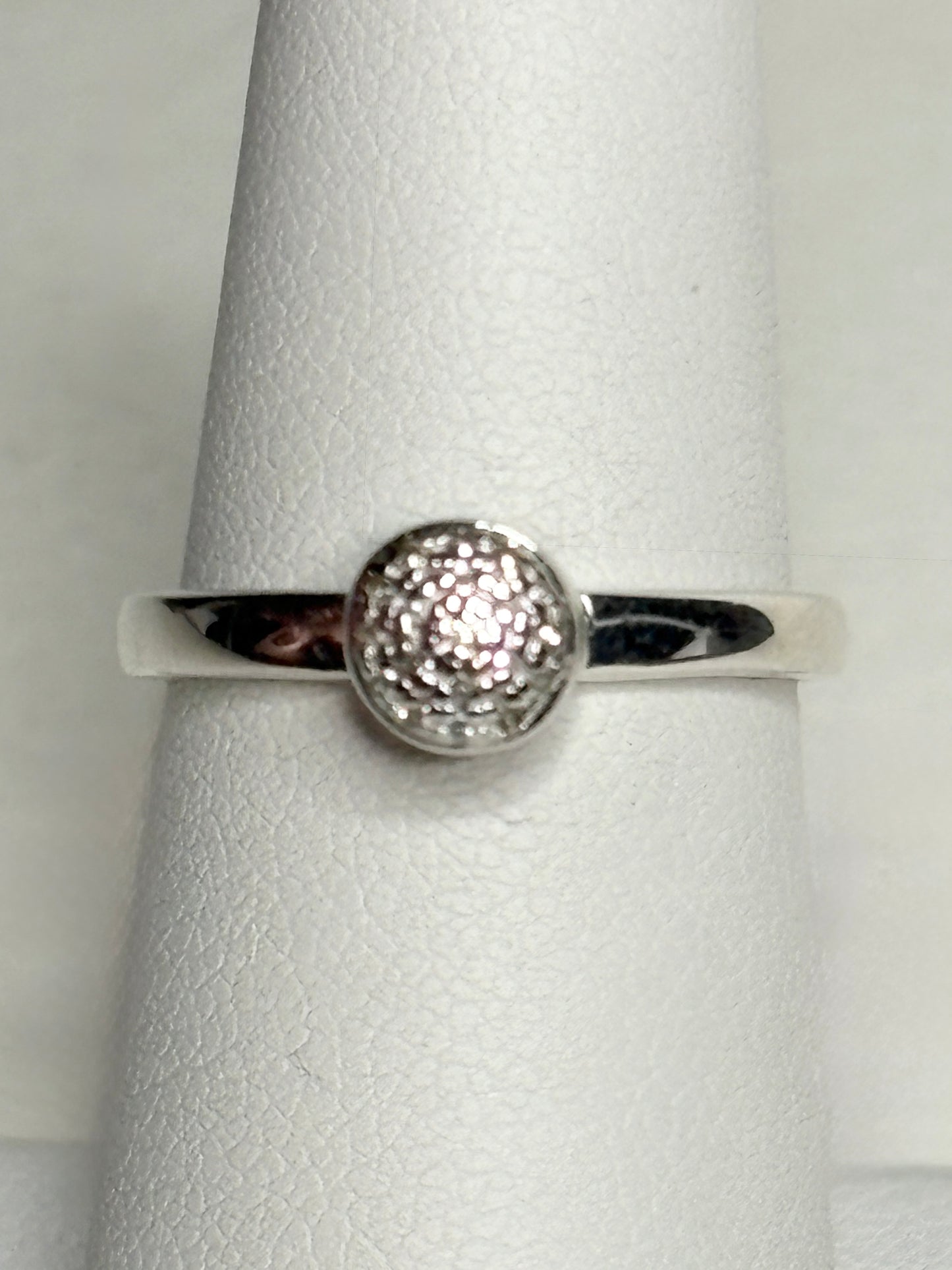 Monica Vinader sterling silver ring with pave diamonds on a button design.