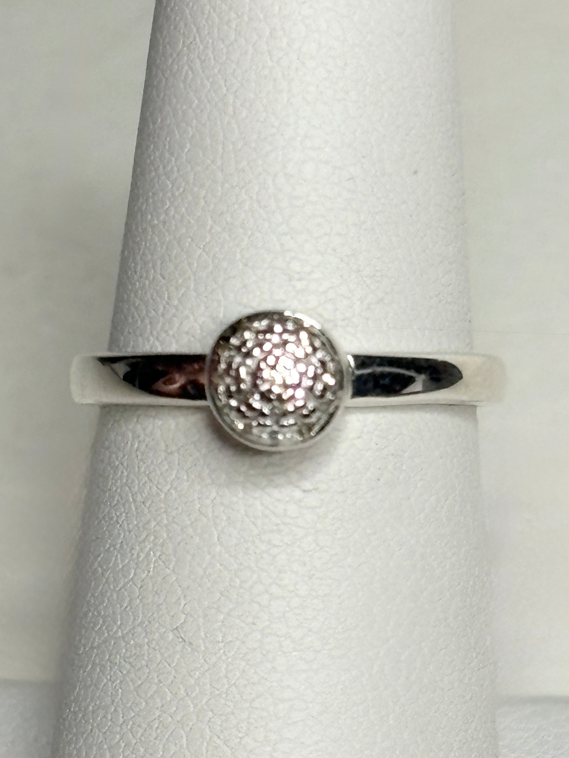 Monica Vinader sterling silver ring with pave diamonds on a button design.