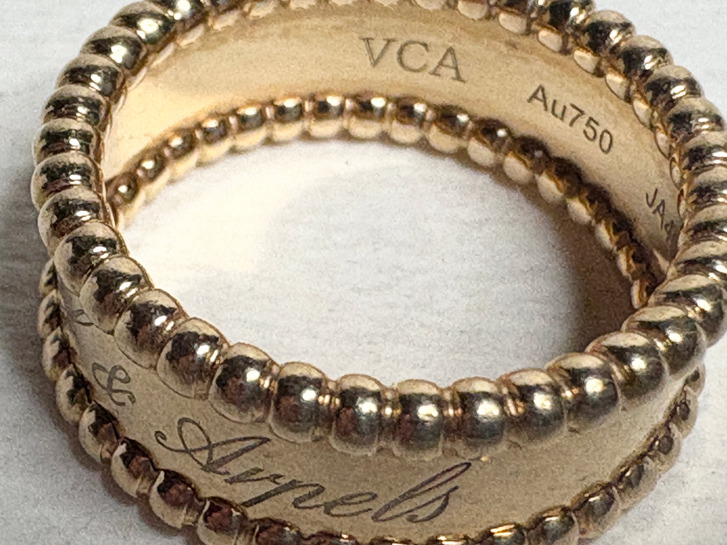 Van Cleef & Arpels Perlee Signature Band ring in 18k gold.