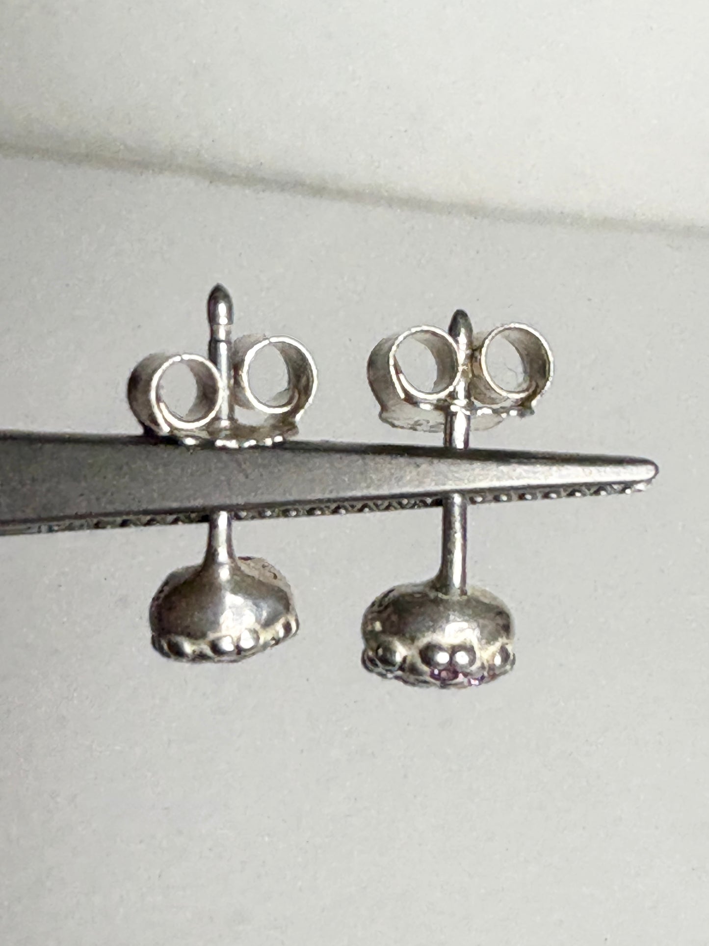 Violet purple pave Pandora stud earrings in sterling silver.