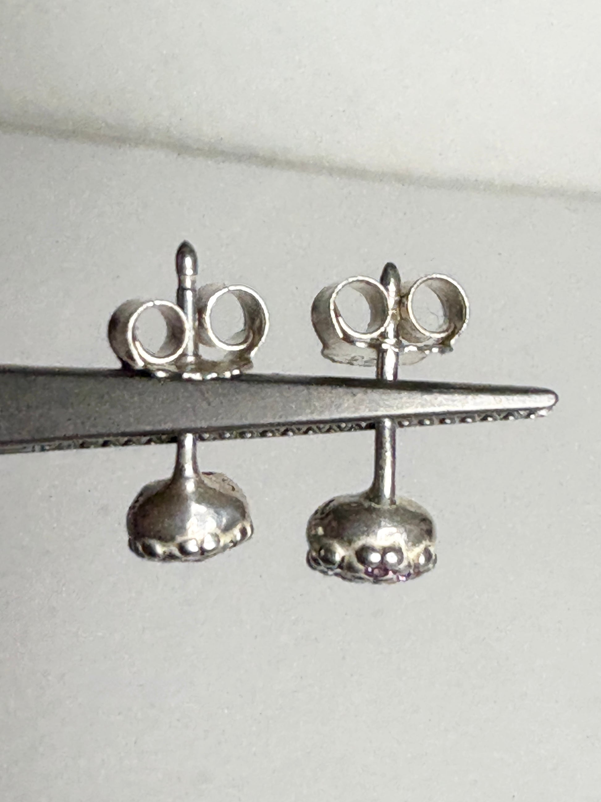 Violet purple pave Pandora stud earrings in sterling silver.