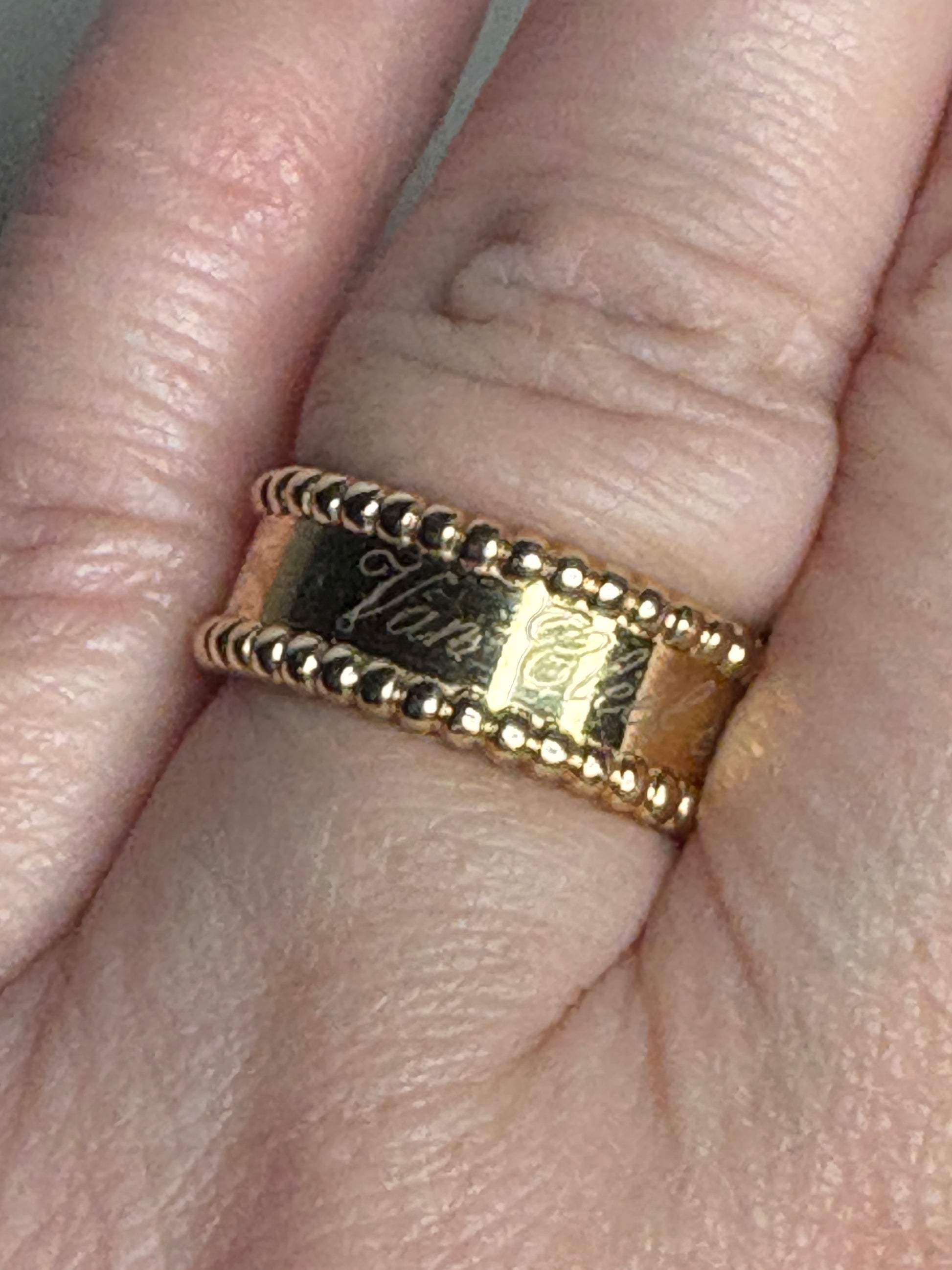 Van Cleef & Arpels Perlee Signature Band ring in 18k gold.
