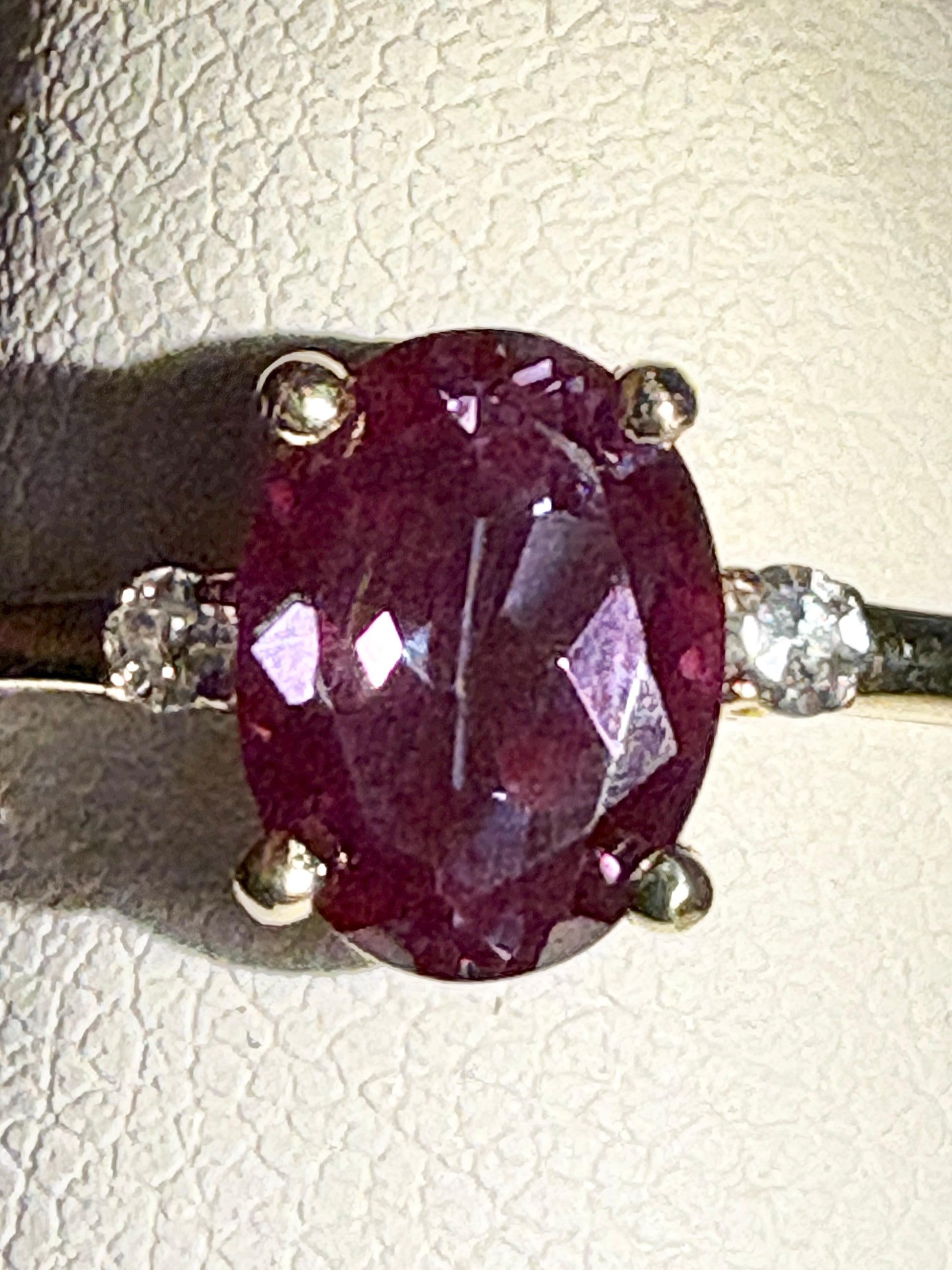 Oval lab grown alexandrite and diamond ring in 10k gold.