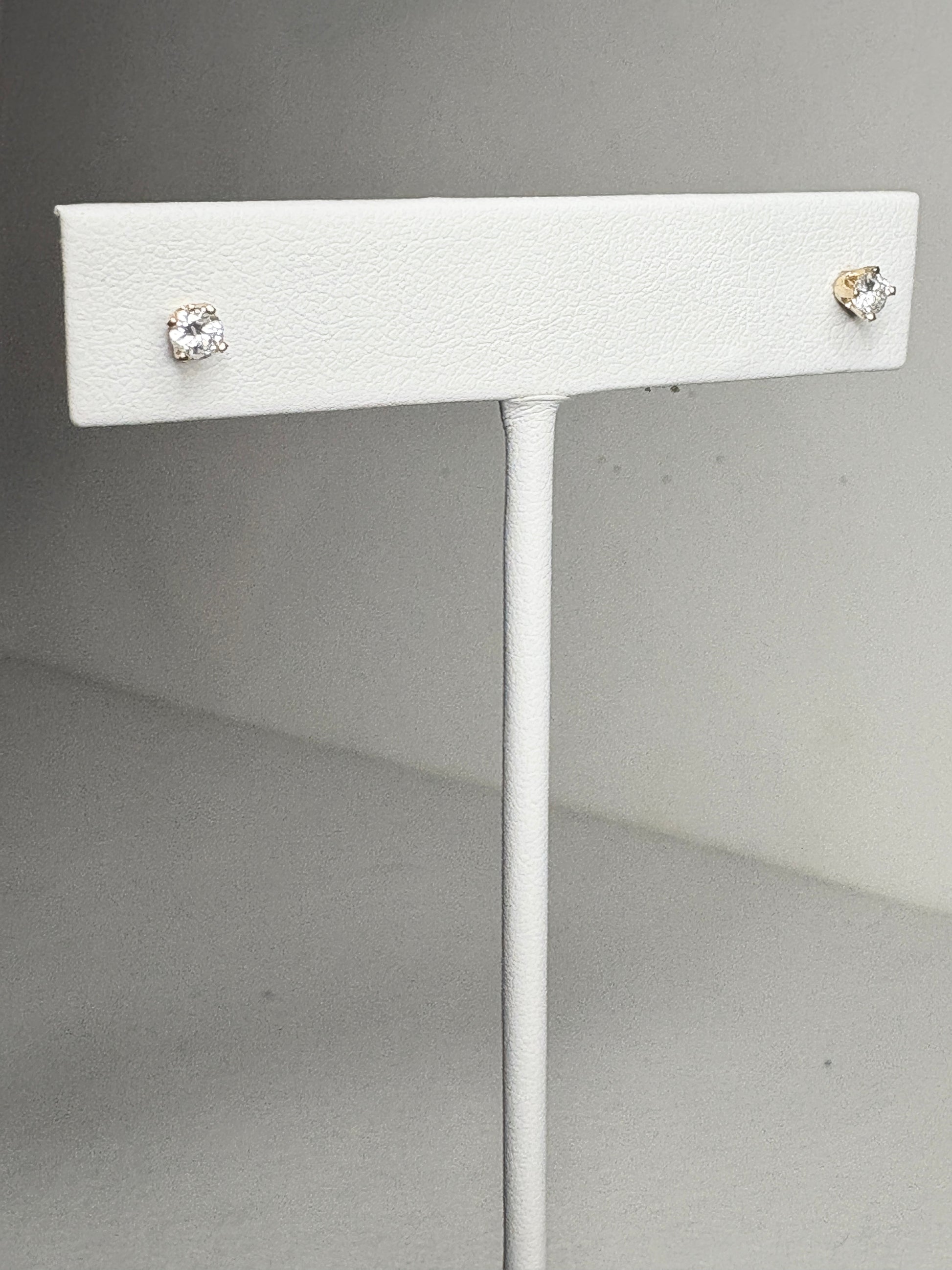 Natural diamond solitaire stud earrings in solid 14k gold.