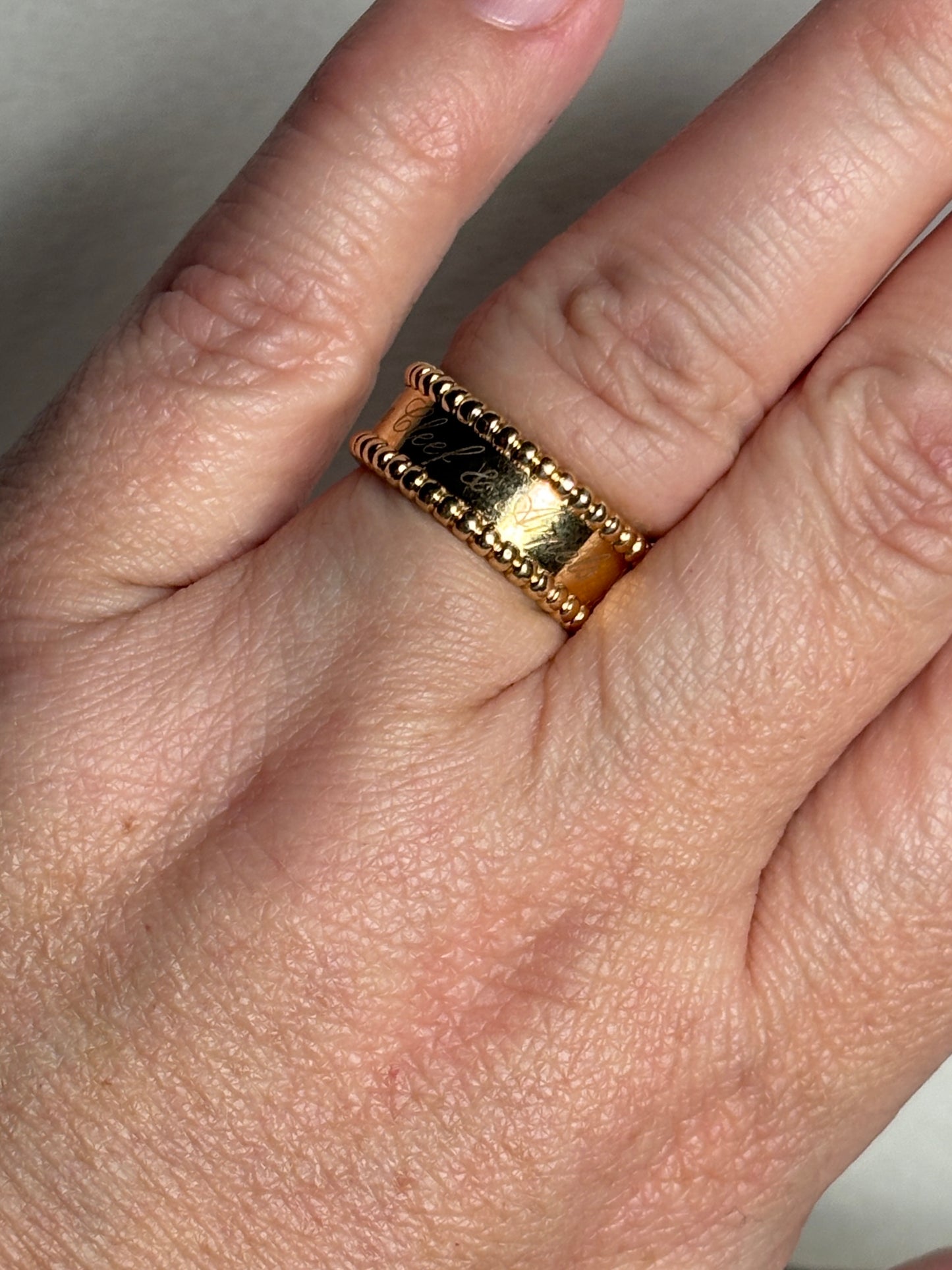 Van Cleef & Arpels Perlee Signature band ring in 18k gold.