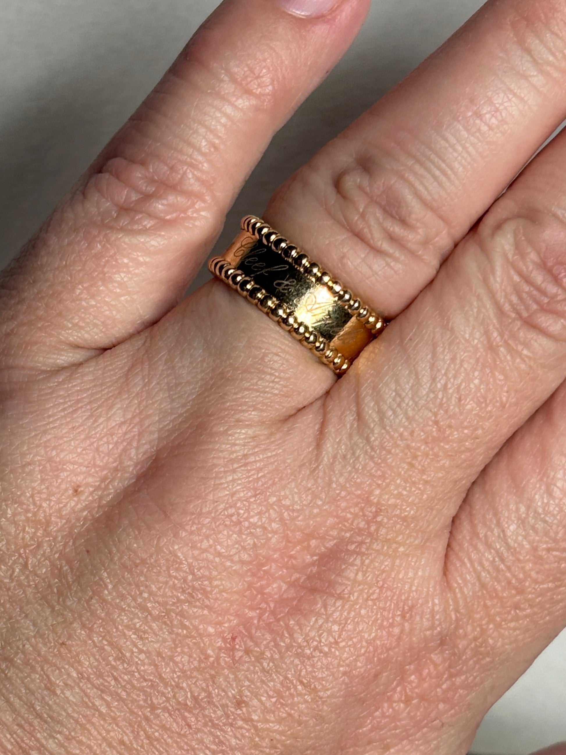 Van Cleef & Arpels Perlee Signature band ring in 18k gold.