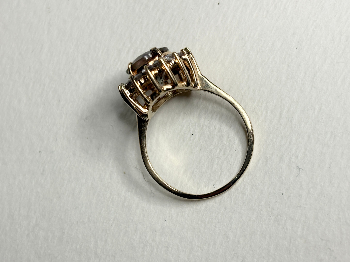 Large dichroic Oregon sunstone and diamond halo ring in solid 14k gold.