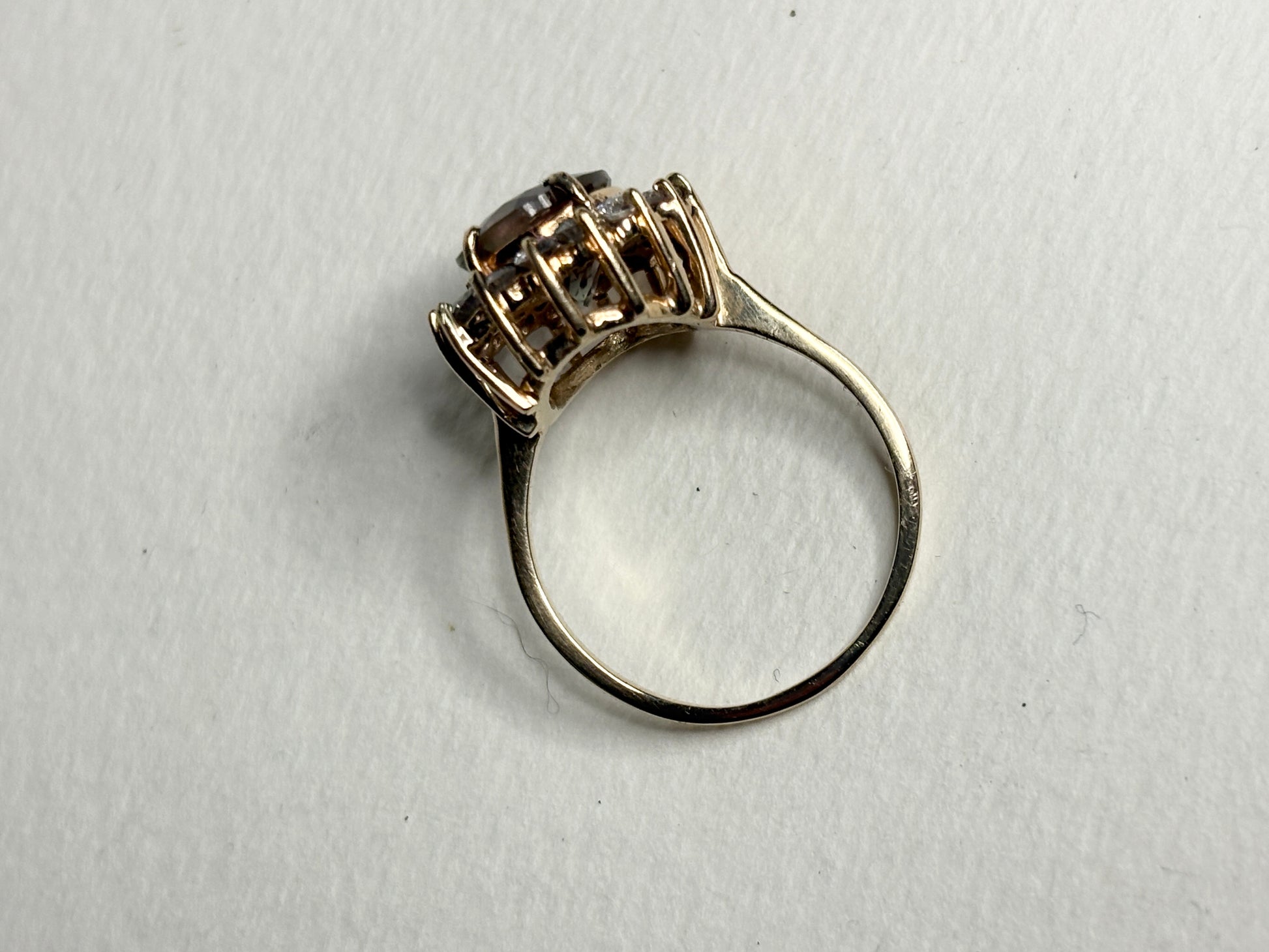 Large dichroic Oregon sunstone and diamond halo ring in solid 14k gold.