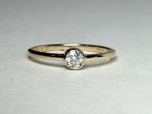 Pandora 14k gold ring with a .25ct bezel-set lab-grown diamond.