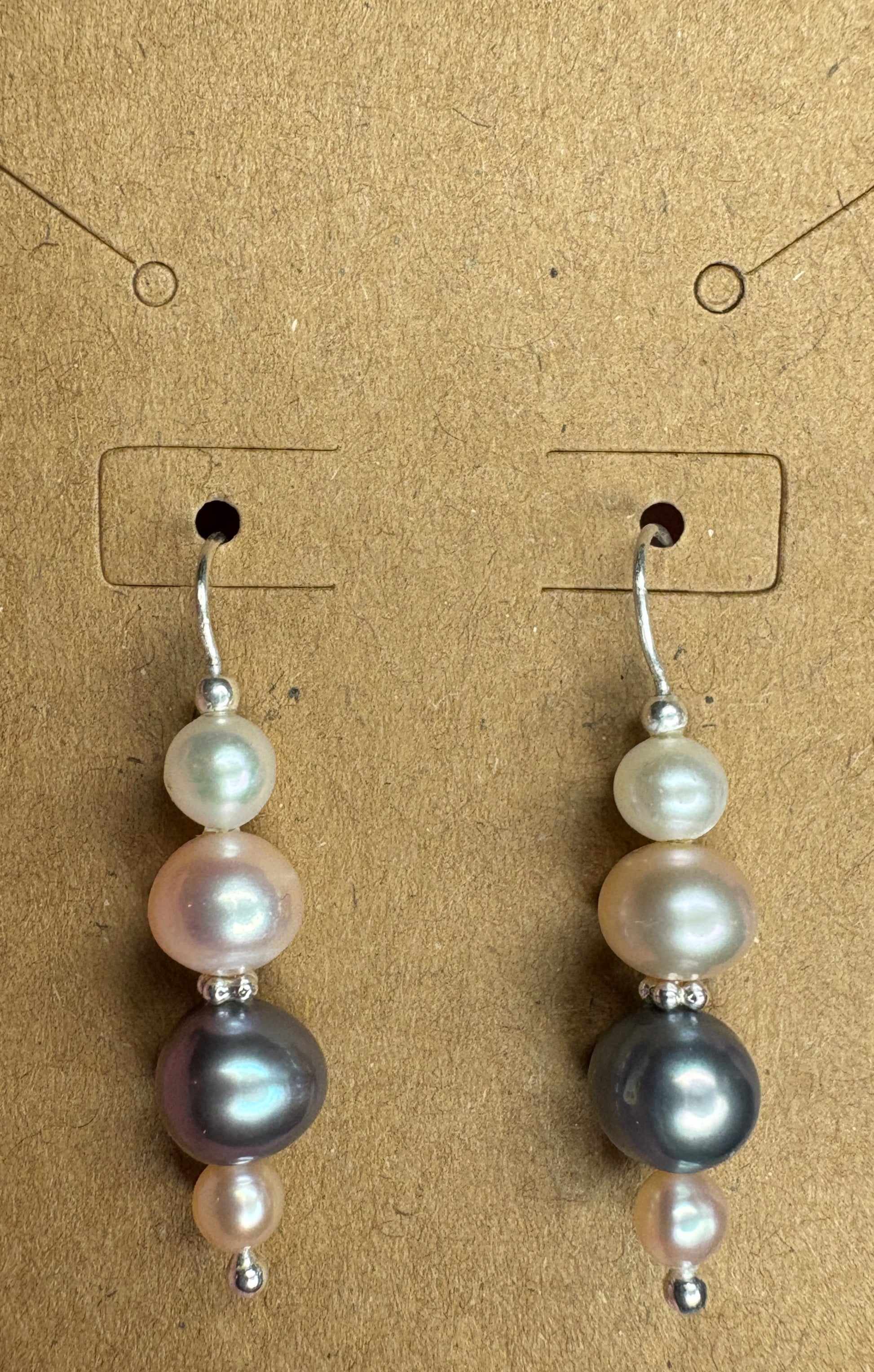 Sterling silver dangle earrings with three colorful freshwater pearls.