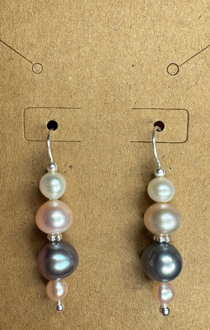Sterling silver dangle earrings with three colorful freshwater pearls.