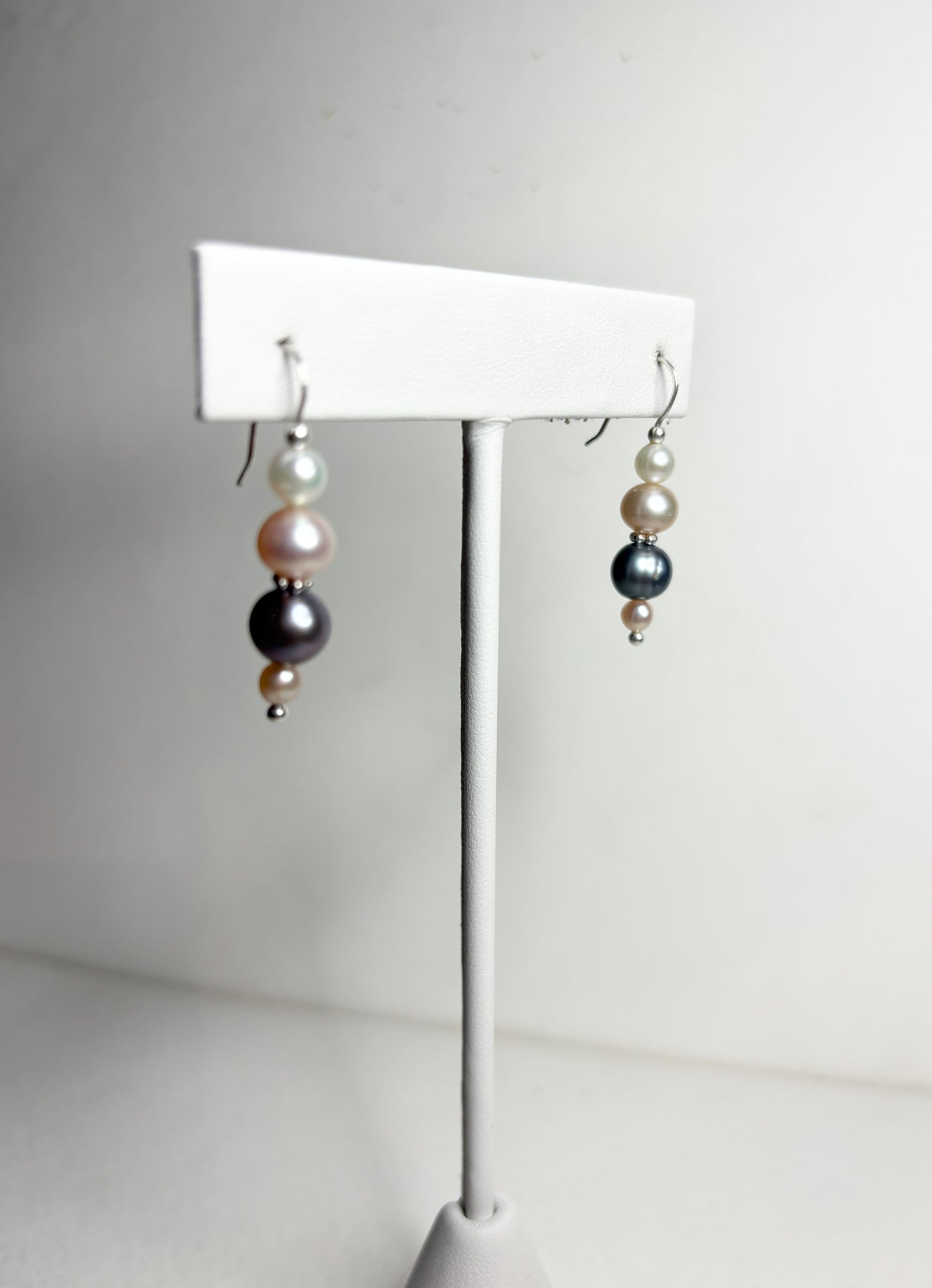 Sterling silver dangle earrings with colorful cultured freshwater pearls.