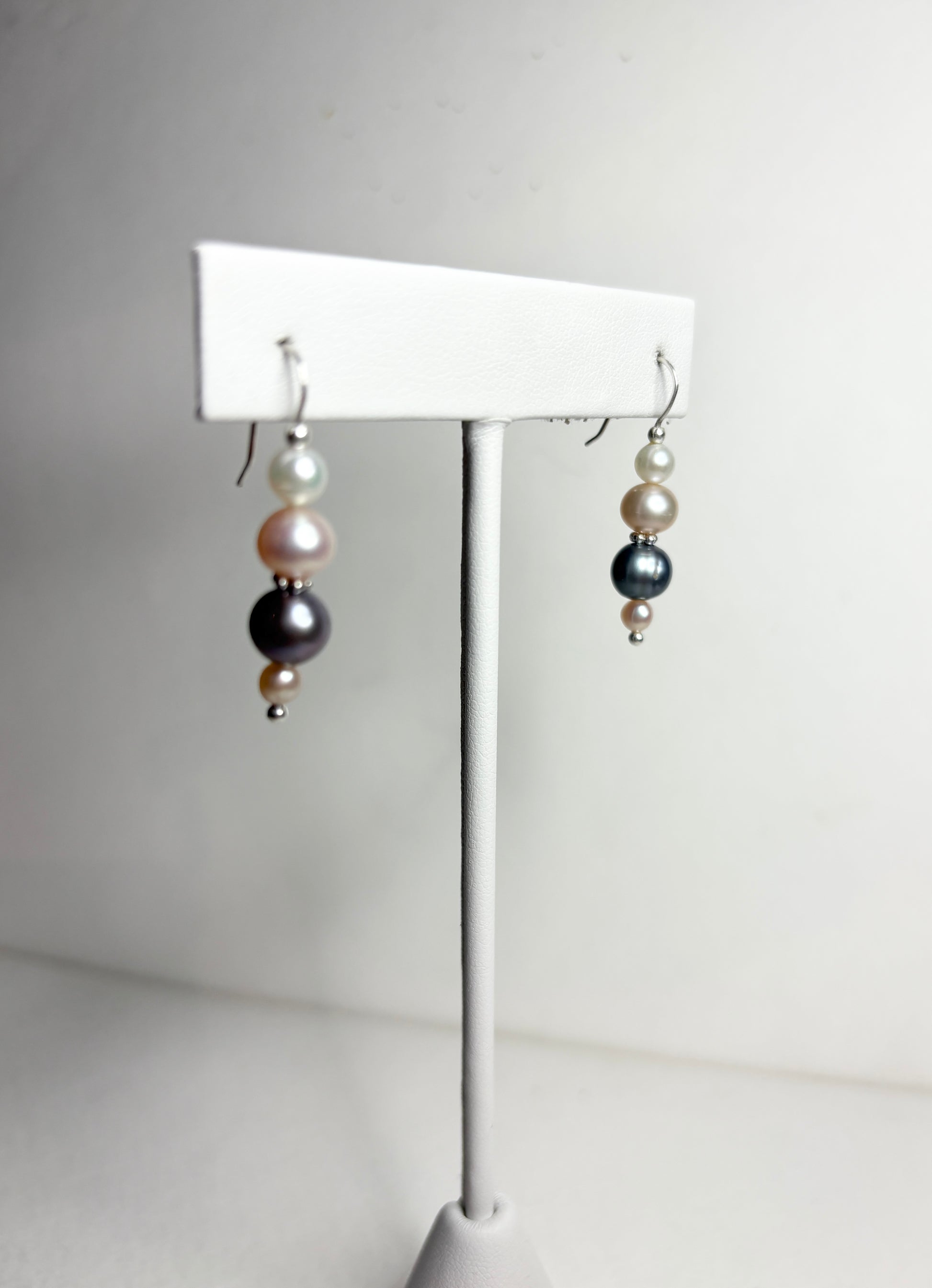 Sterling silver dangle earrings with colorful cultured freshwater pearls.