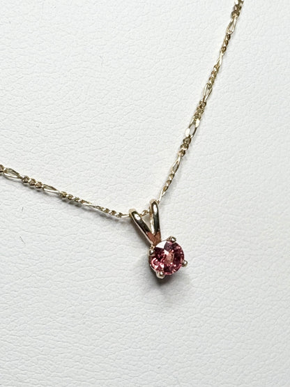 Small Padparadcha sapphire solitaire pendant necklace in solid 14k gold.