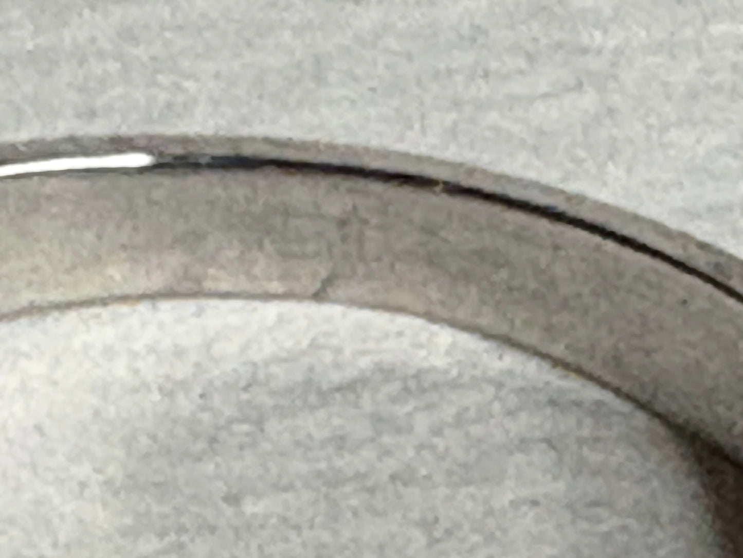 Platinum ring with a pink sapphire and pear-shaped diamonds.