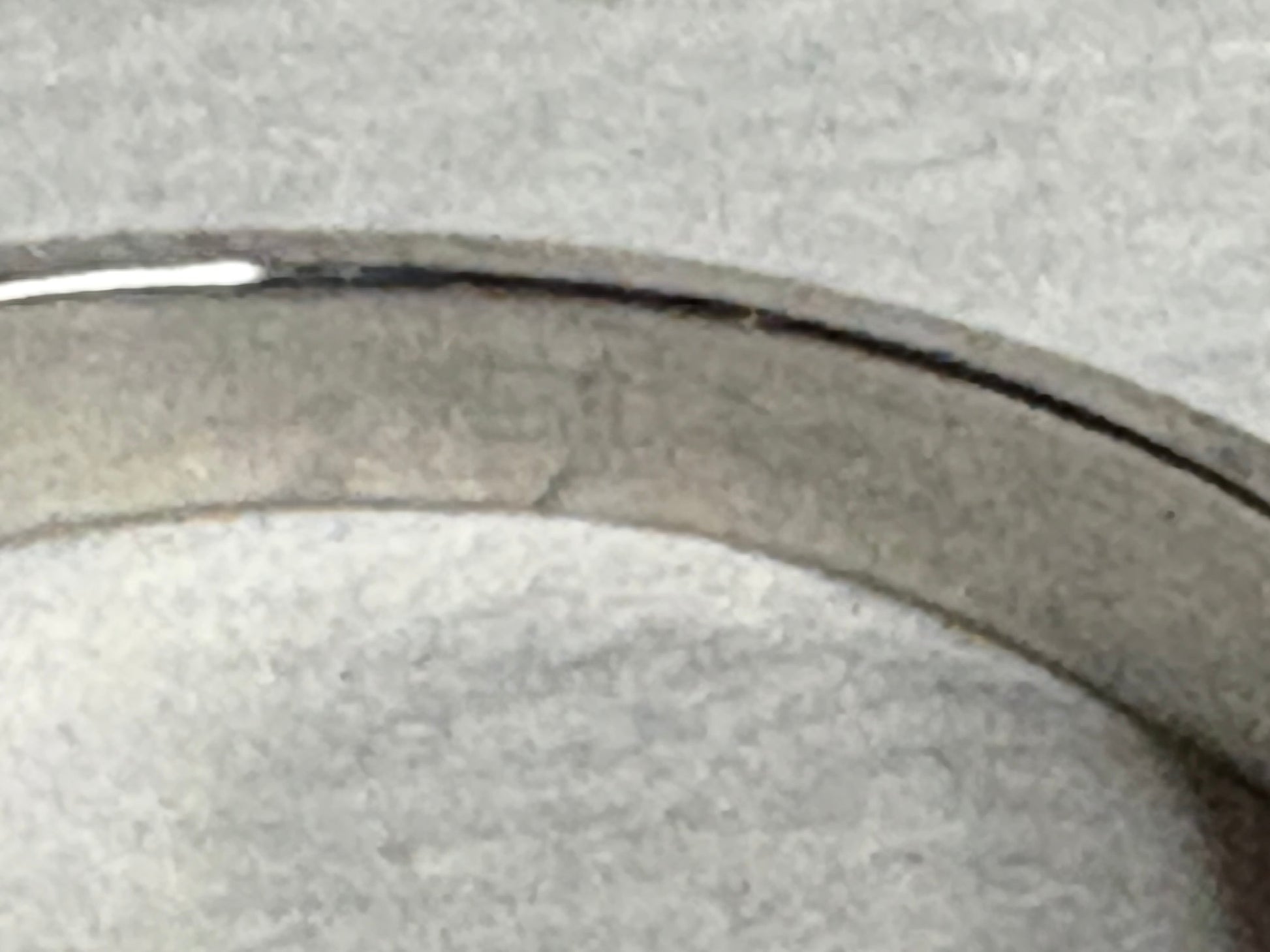 Platinum ring with a pink sapphire and pear-shaped diamonds.