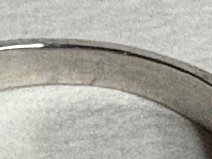 Platinum ring with a pink sapphire and pear-shaped diamonds.