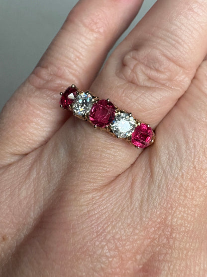 Antique 14k gold band ring with red spinels and old mine cut diamonds.