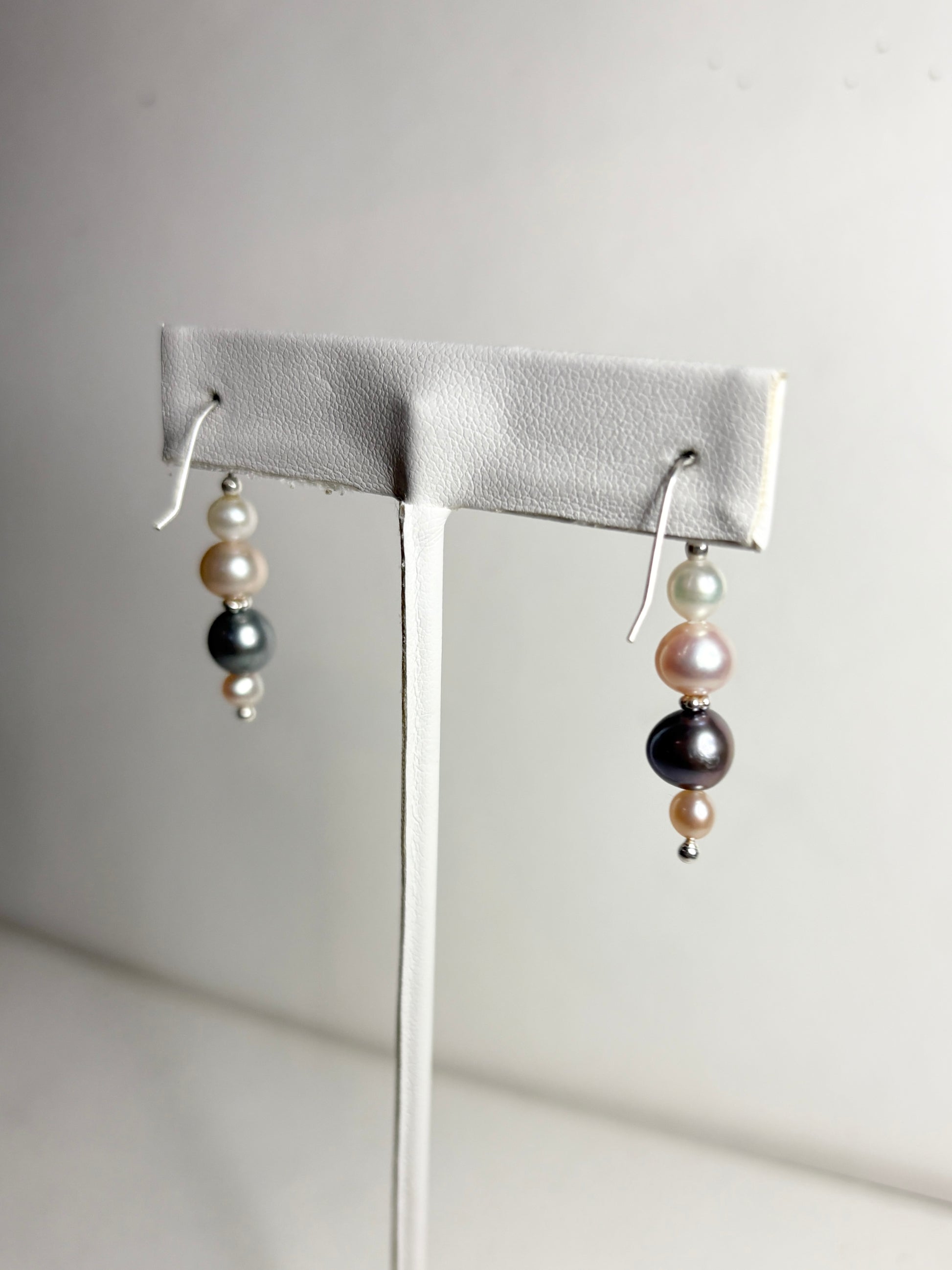 Sterling silver dangle earrings with colorful freshwater pearls.