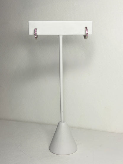 Sterling silver small huggie hoop earrings with rhodolite garnets.