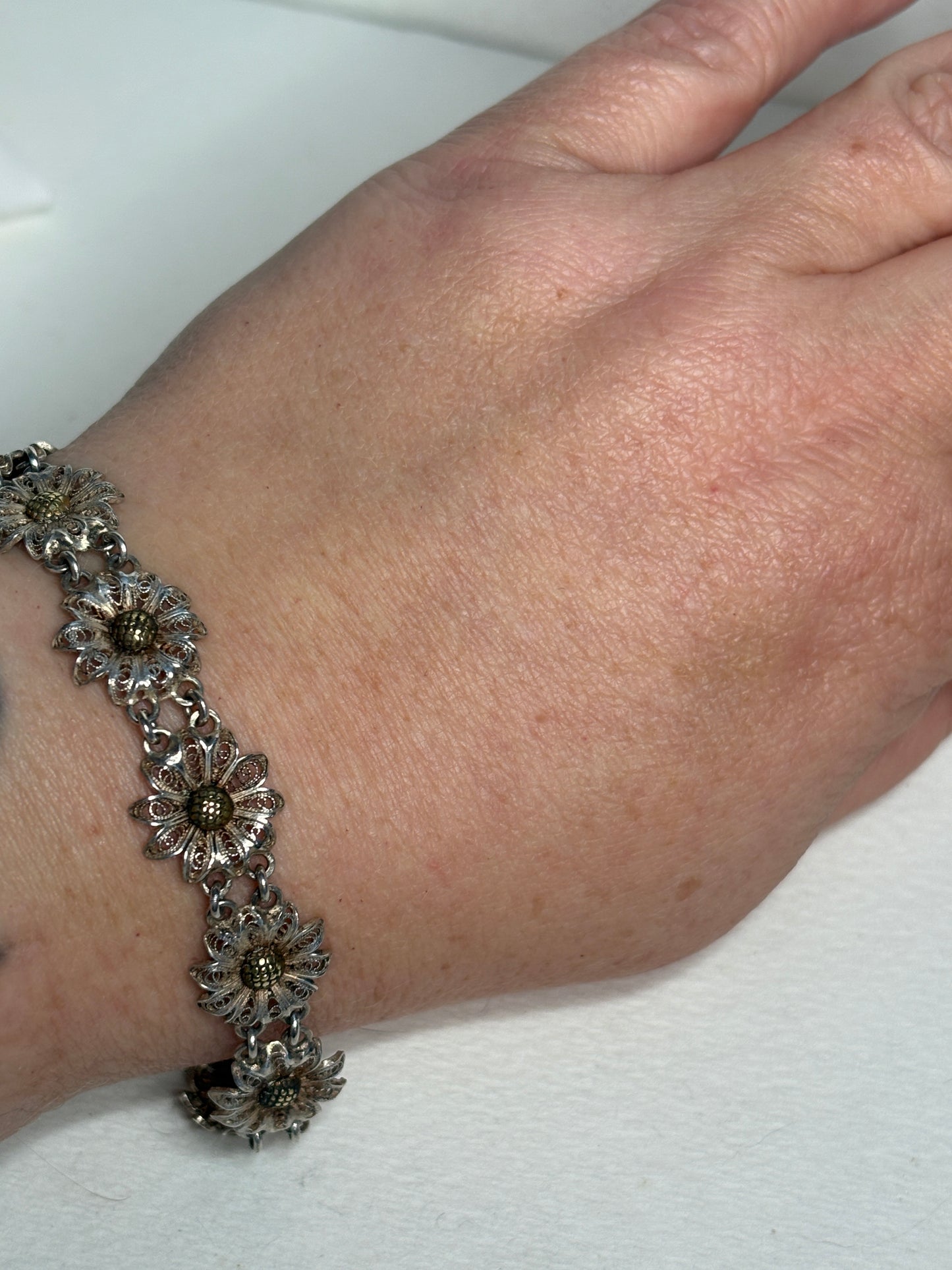 Vintage two-toned 800 silver filigree floral daisy bracelet with gold-plated centers.