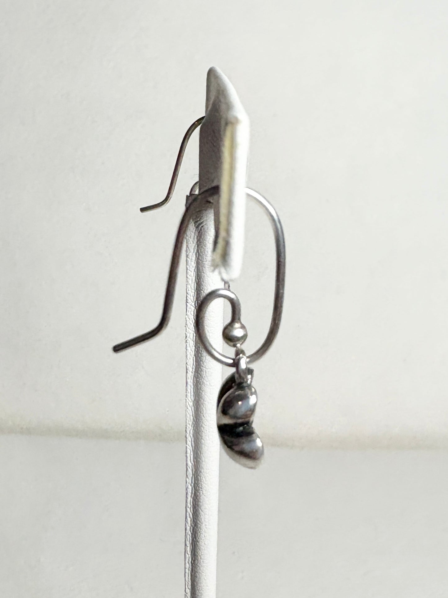 Sterling silver Pandora dangle earrings with a coiled design and a removable cherry blossom charm.