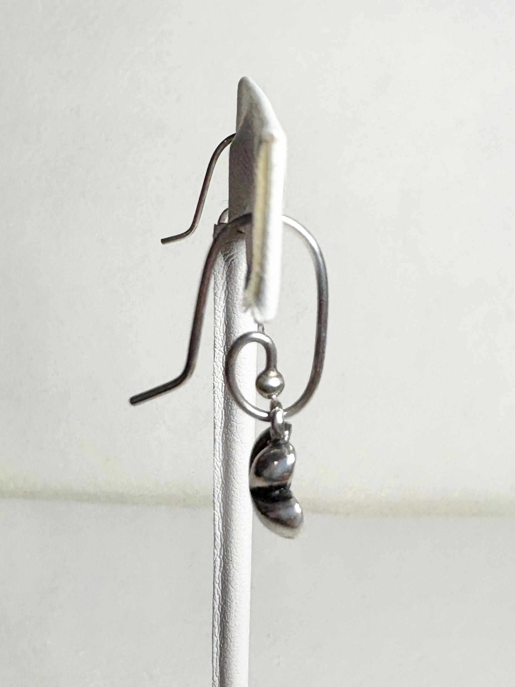 Sterling silver Pandora dangle earrings with a coiled design and a removable cherry blossom charm.