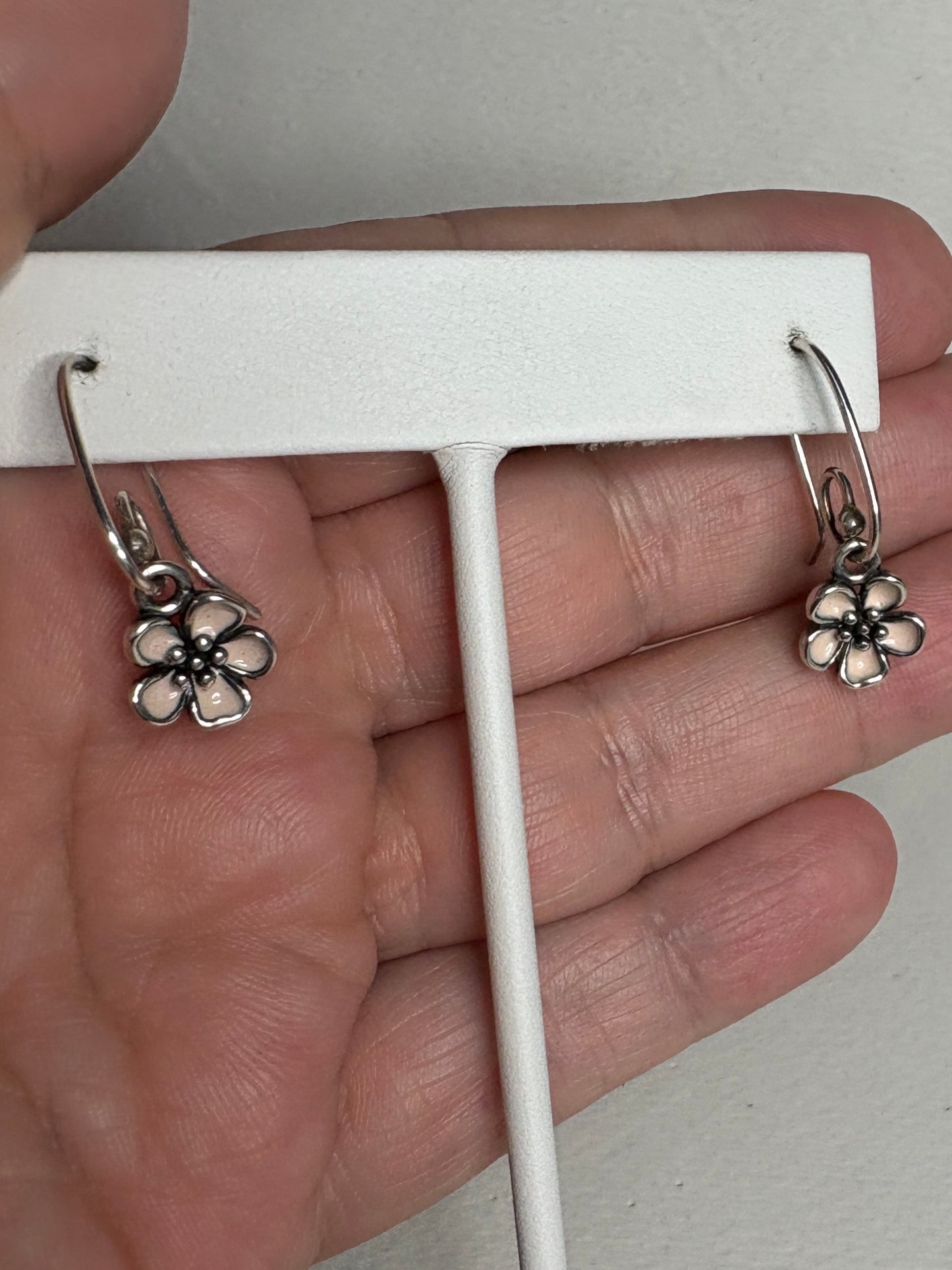 Pandora sterling silver dangle earrings with pink enamel cherry blossom charms.
