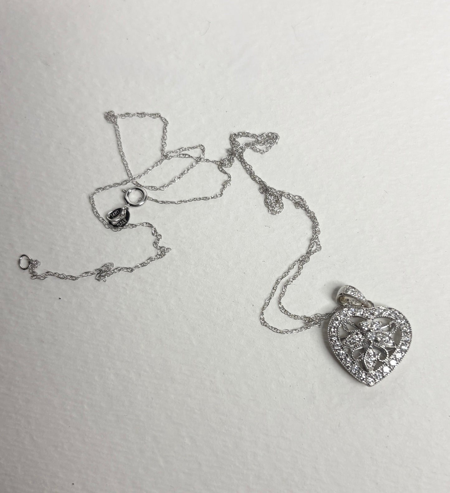 14k white gold heart pendant necklace with natural diamonds.