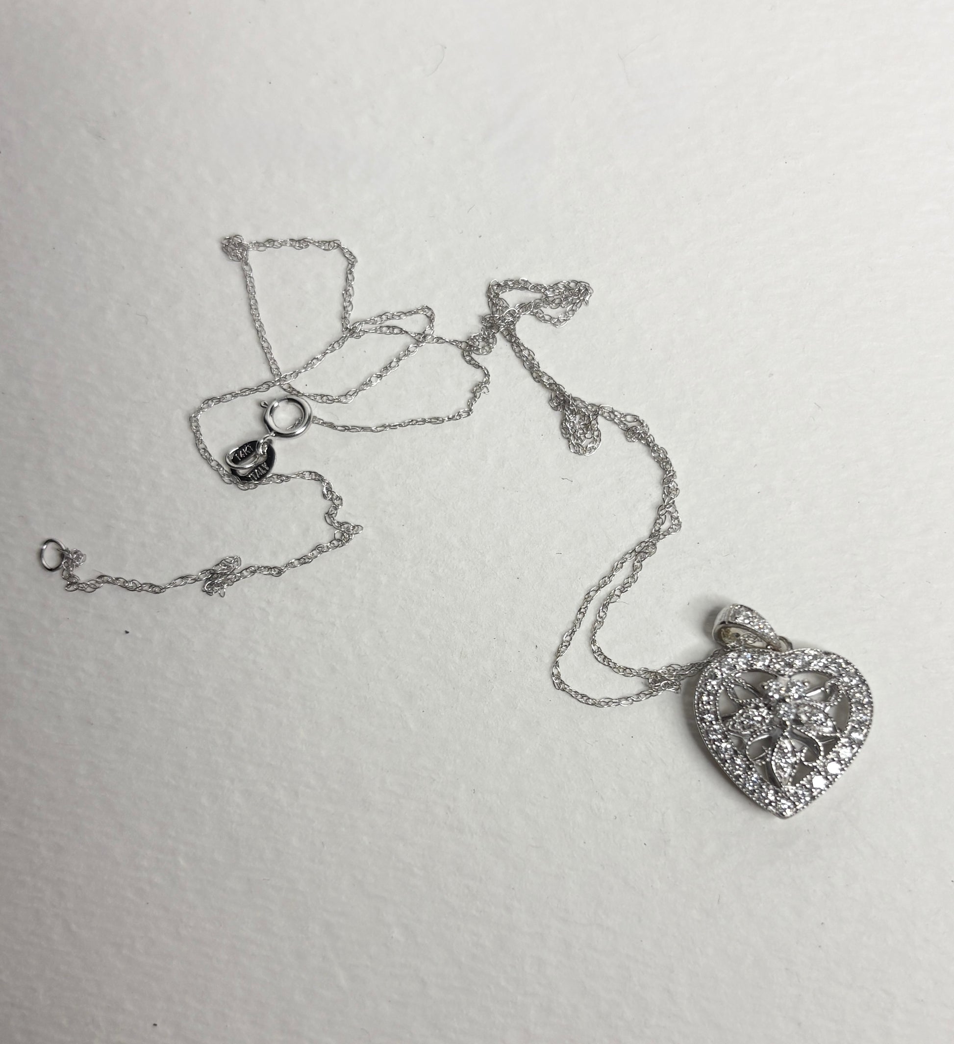 14k white gold heart pendant necklace with natural diamonds.